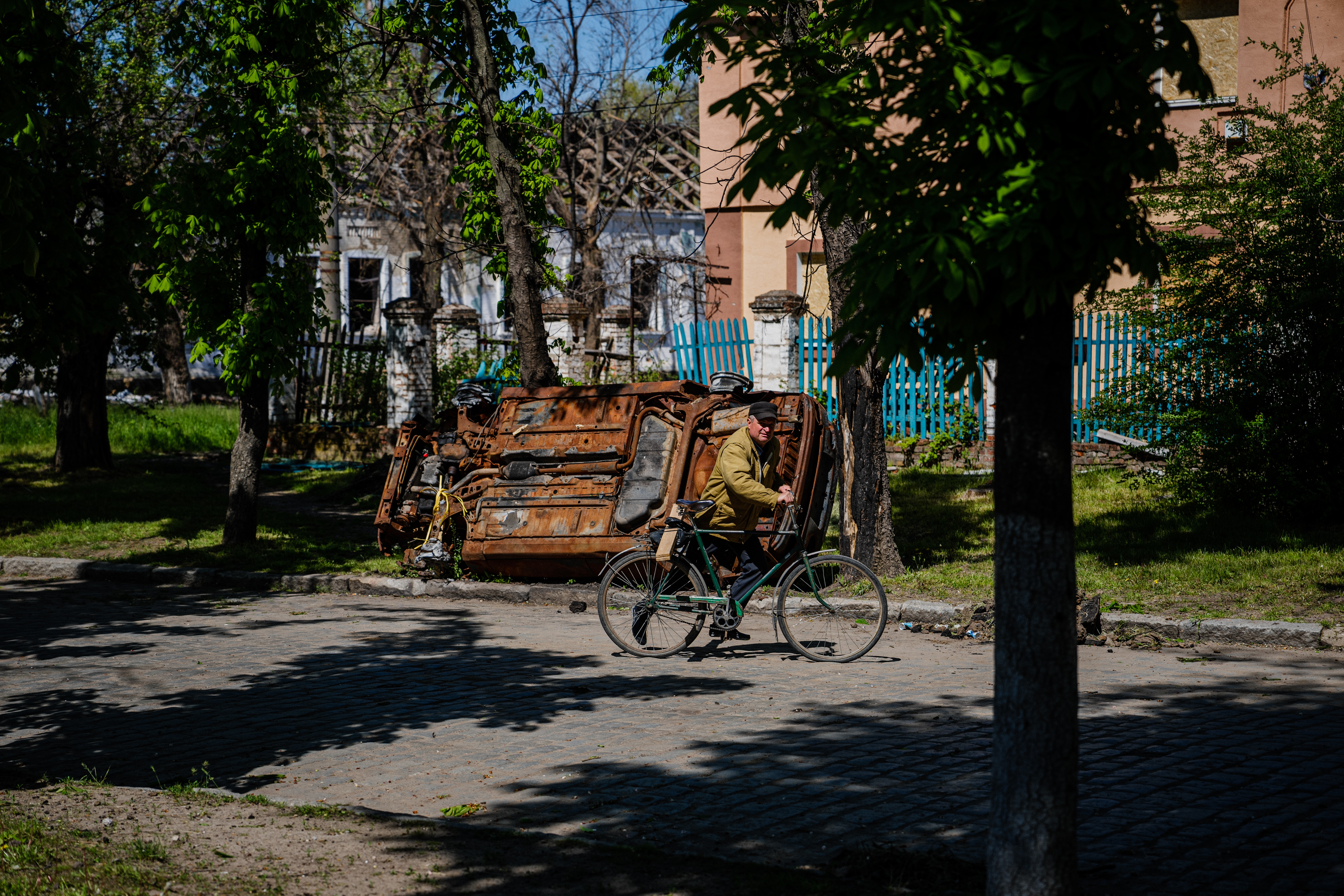 Local residents sit in a volunteer run shelter, providing access to laundry and bathroom facilities where they can warm up, charge their phones, drink hot tea and receive humanitarian aid in the town of Orikhiv, in the Zaporizhzhia region