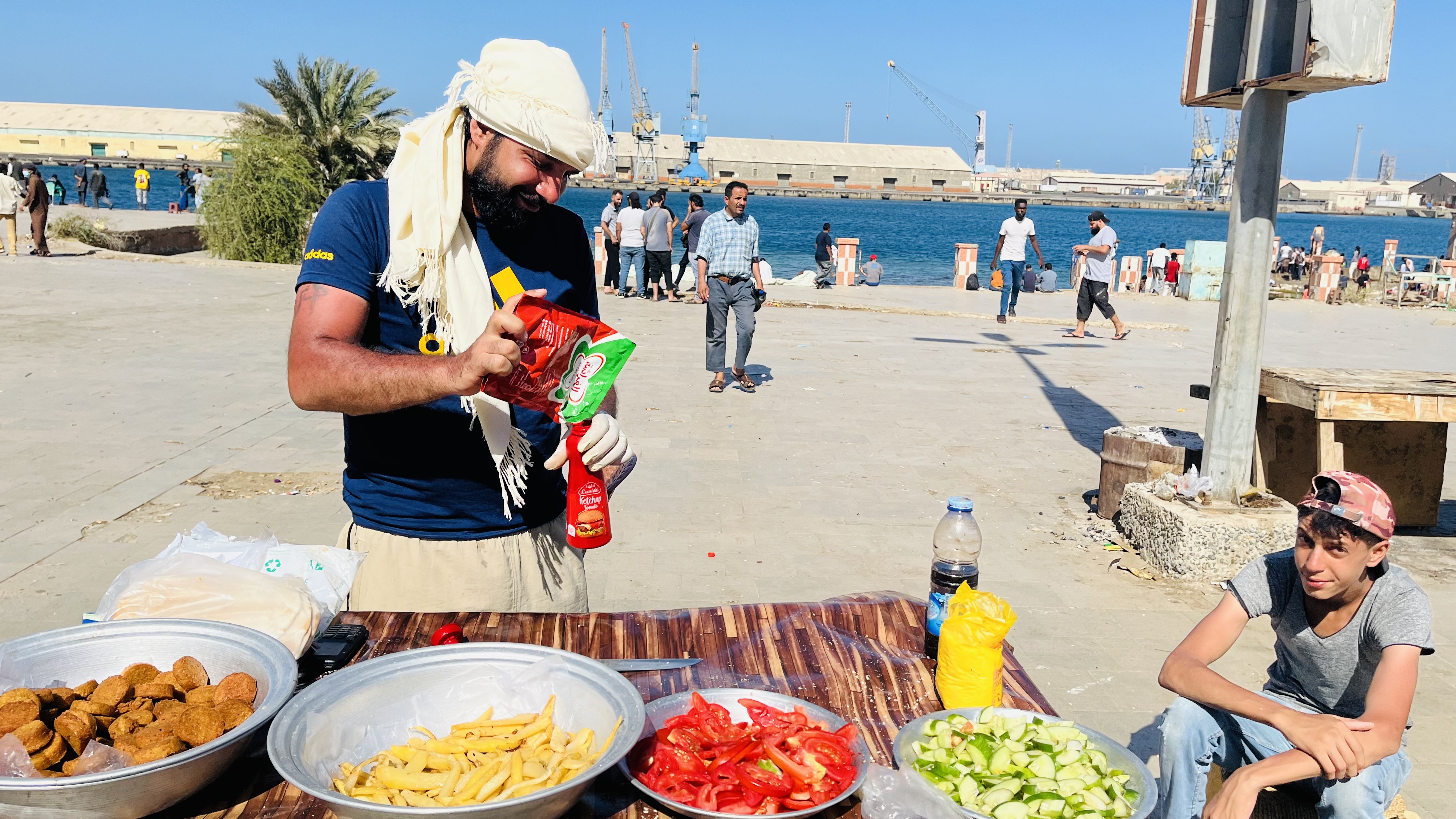 Mohamed at his makeshift stall selling falafel sandwiches