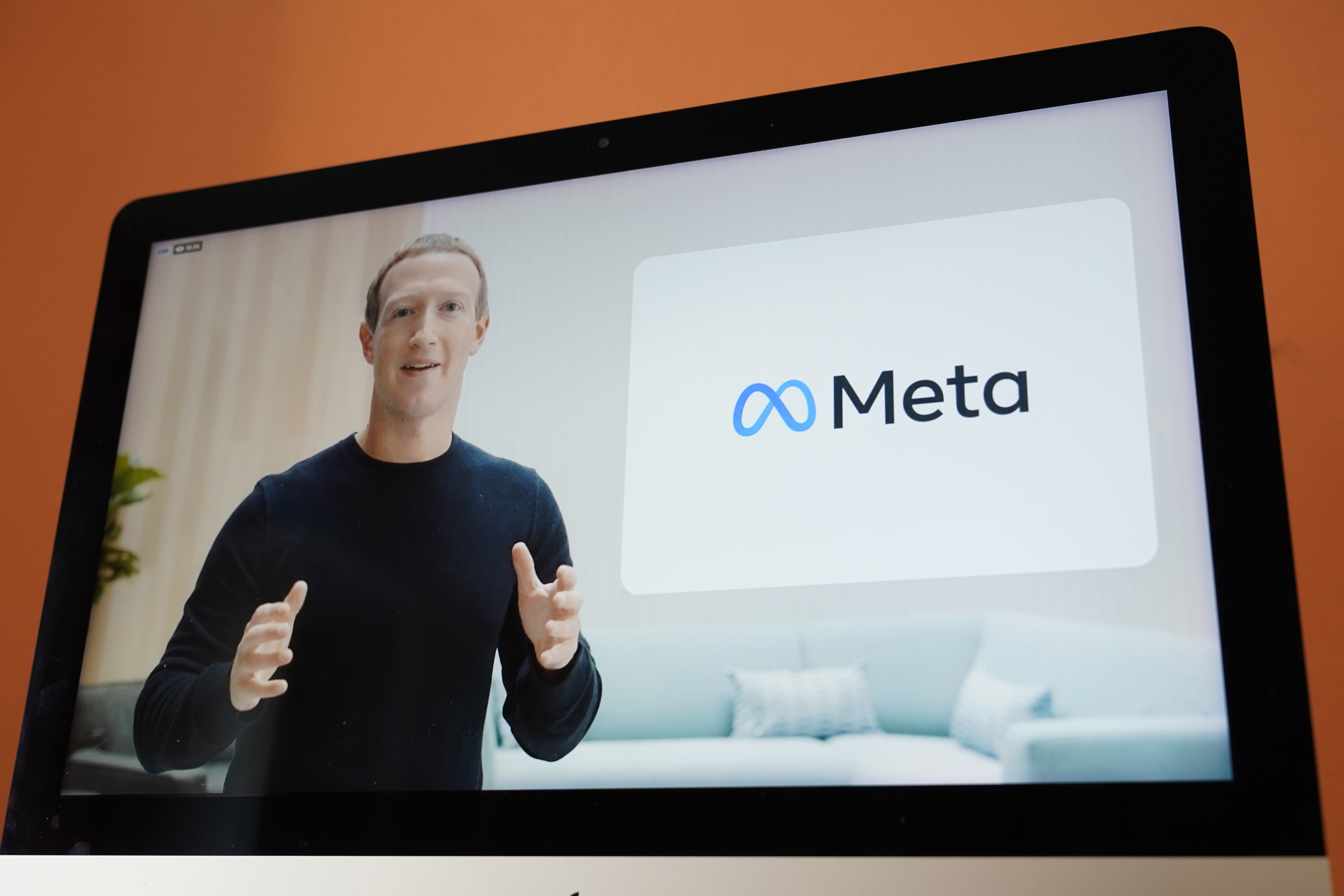 Seen on the screen of a device in Sausalito, Calif., Facebook CEO Mark Zuckerberg announces their new name, Meta