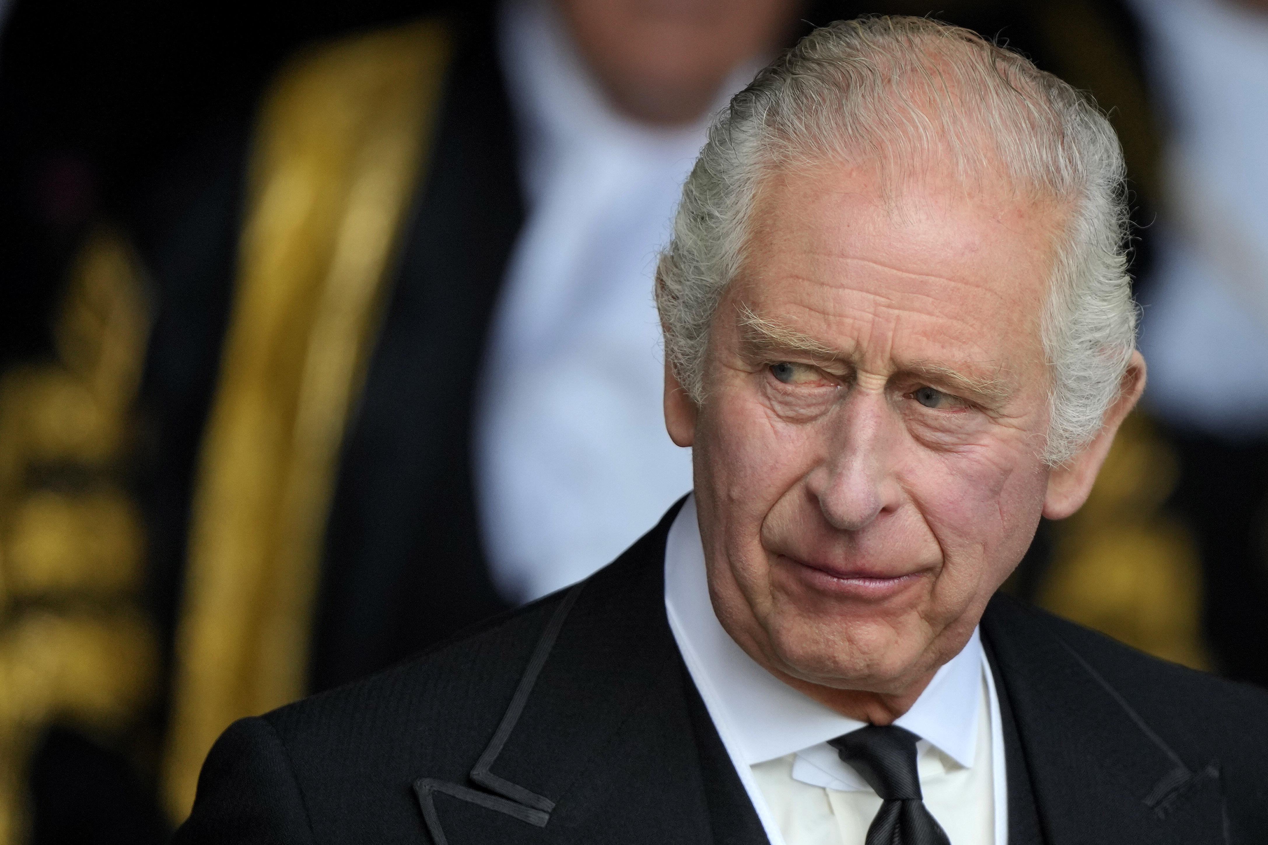 King Charles III leaves Westminster Hall, in the Palace of Westminster, where the House of Commons and the House of Lords met to express their condolences in London, Monday, Sept. 12, 2022.