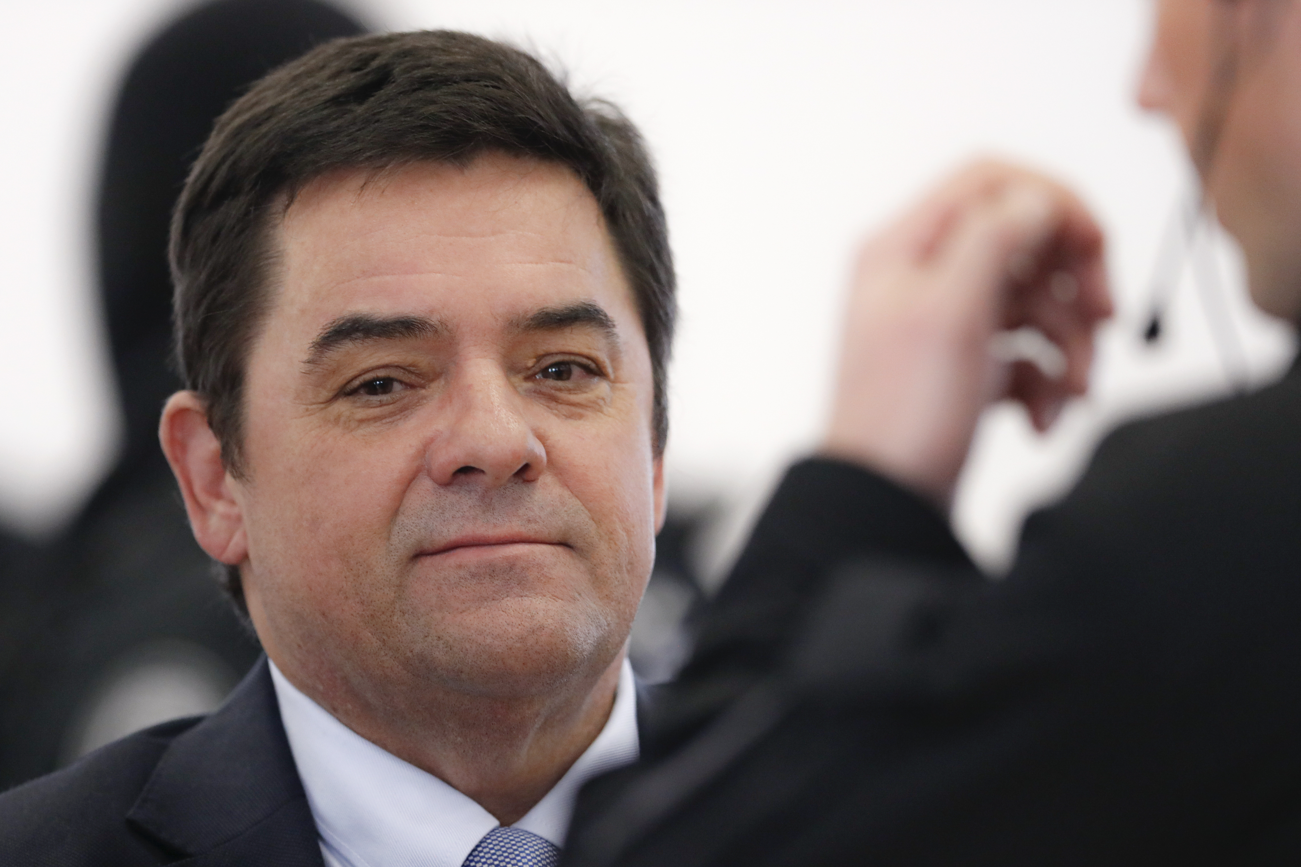 Marian Kocner the suspected mastermind in the slaying of an investigative journalist Jan Kuciak and his fiancee Martina Kusnirova, is escorted by armed police officers from a courtroom after a trial session in Pezinok