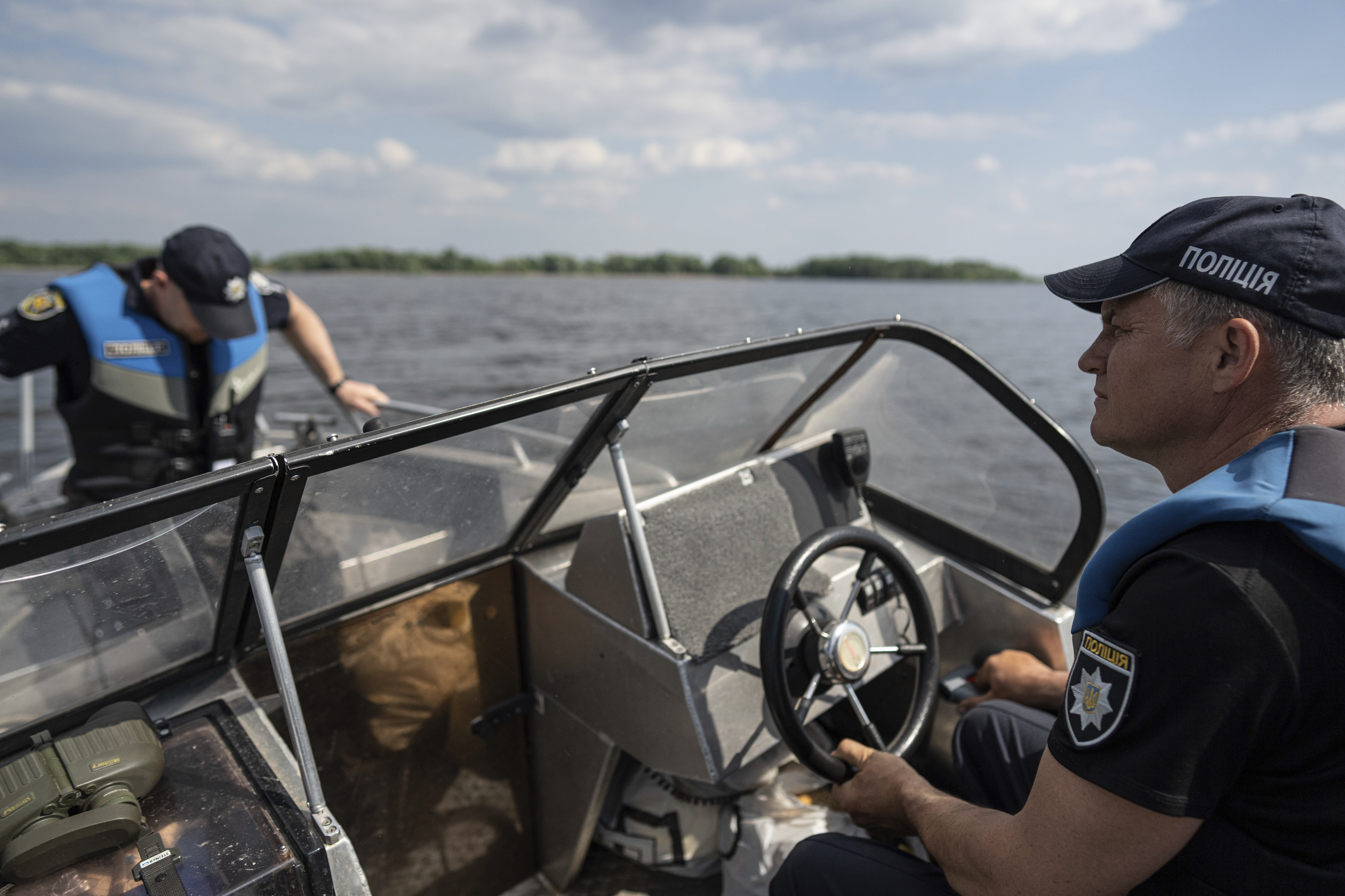 Police officers patrol area of Kakhovka reservoir on Dnipro river