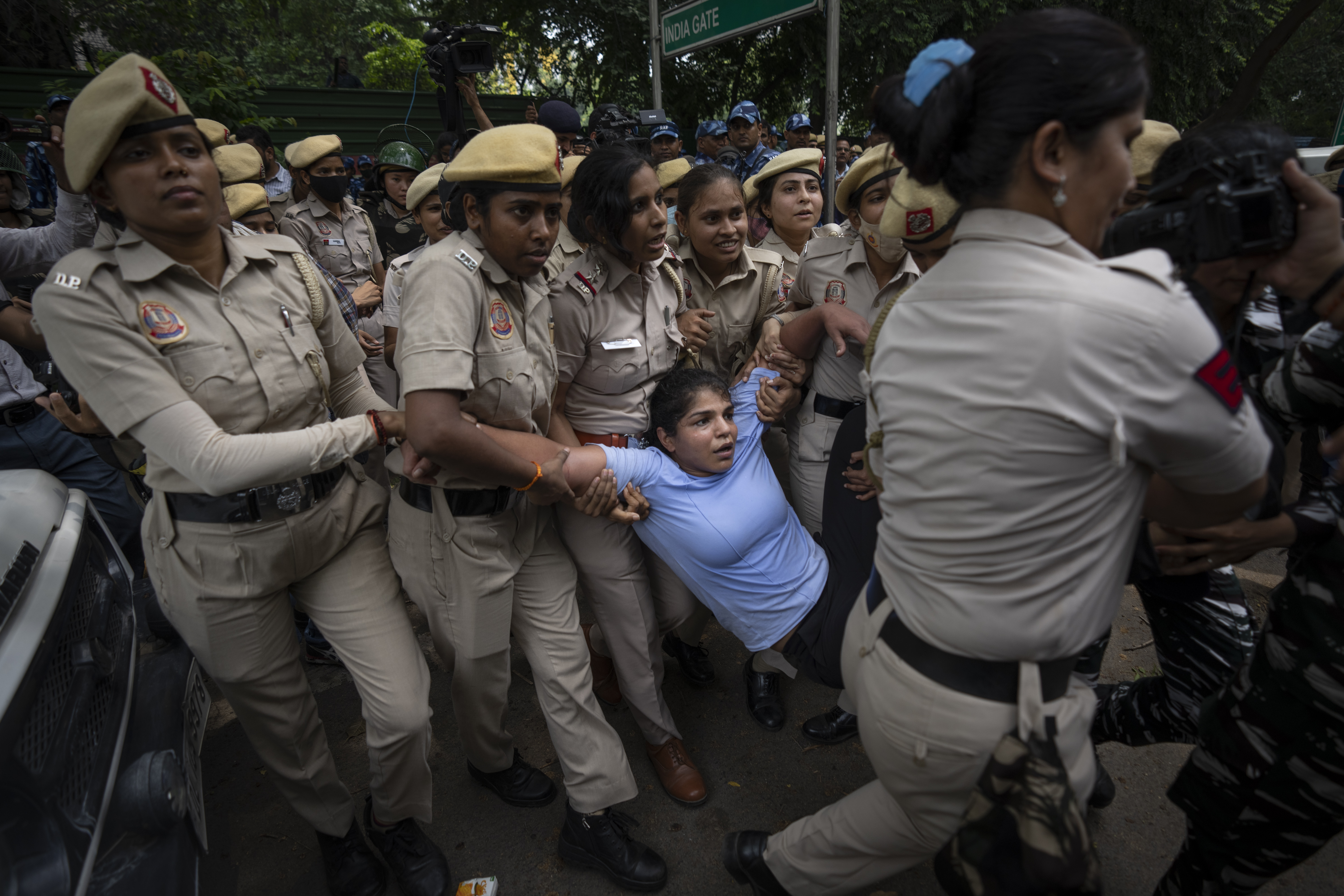 Sakshi Malik, in blue, an Indian wrestler who won a bronze medal at the 2016 Summer Olympics,