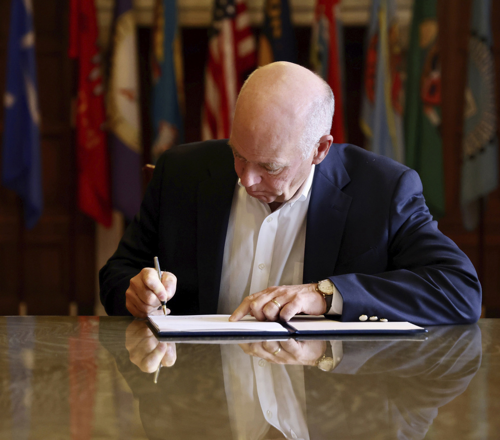 Montana Governor Greg Ganforte signing the TikTok ban in this photo provided by the Montana Governor's Office.