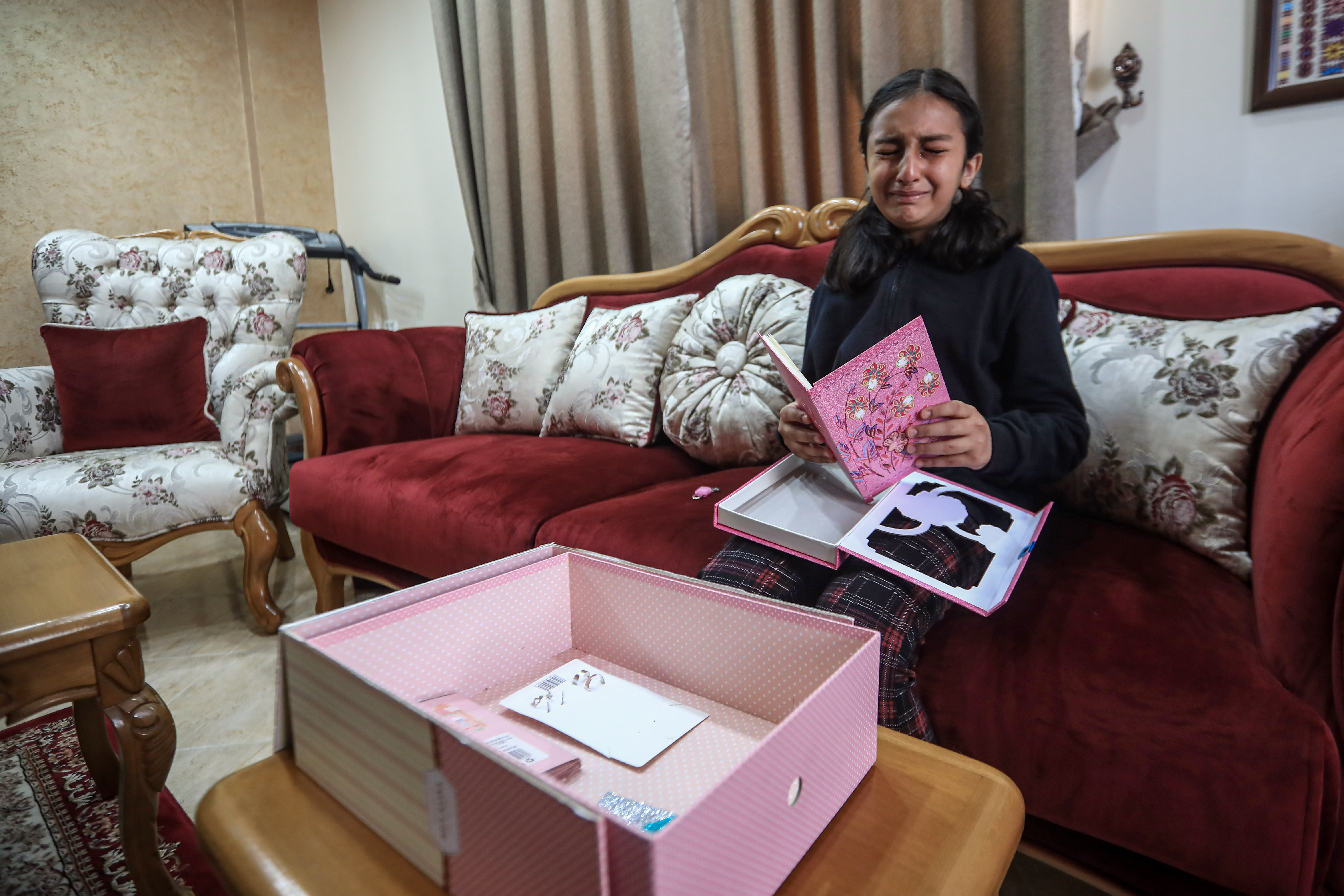 A girl crying over her deceased friend 