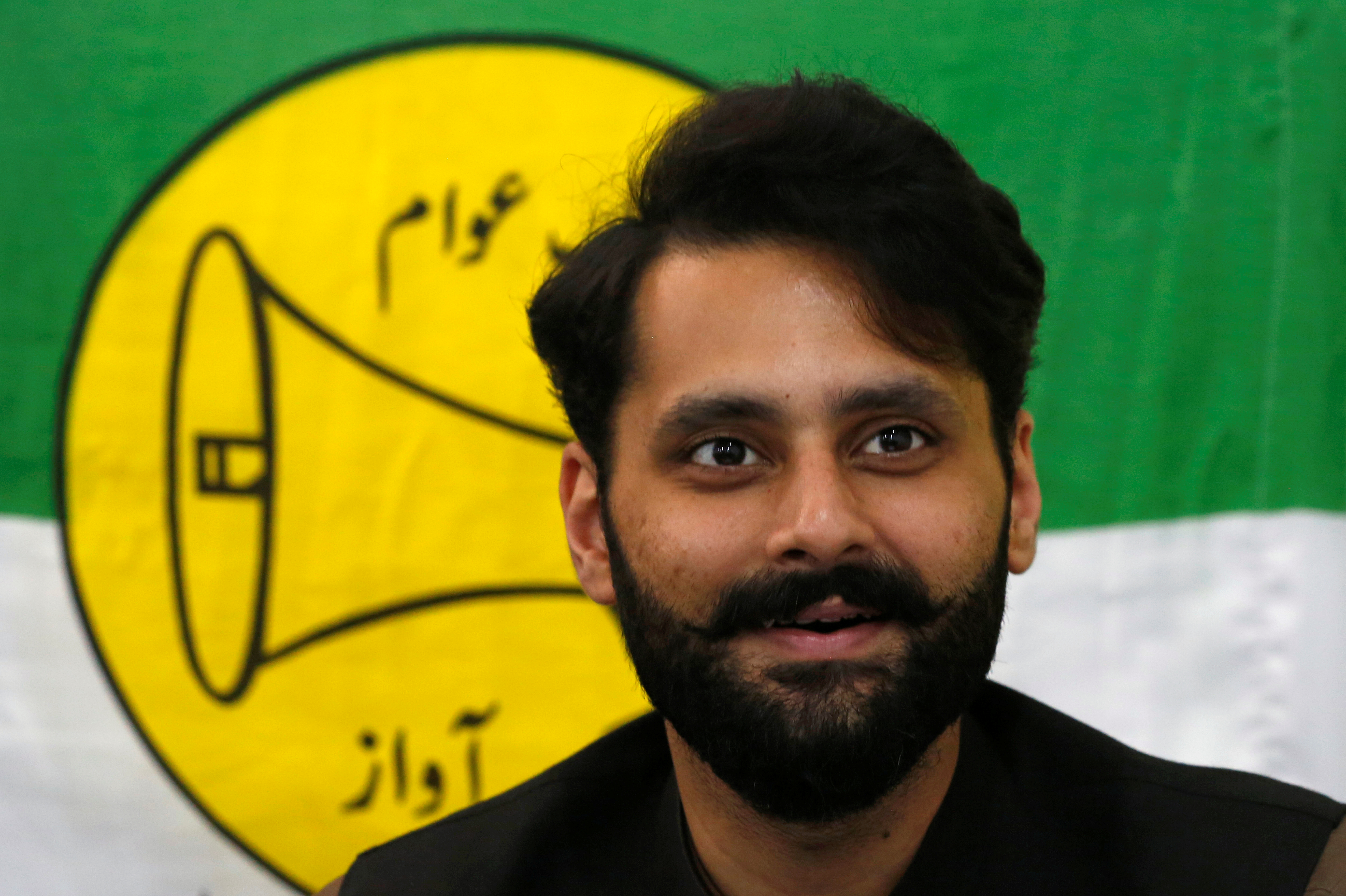 Jibran Nasir, a human rights lawyer and independent candidate for general election, speaks at his office in Karachi, Pakistan July 23, 2018. REUTERS/Akhtar Soomro