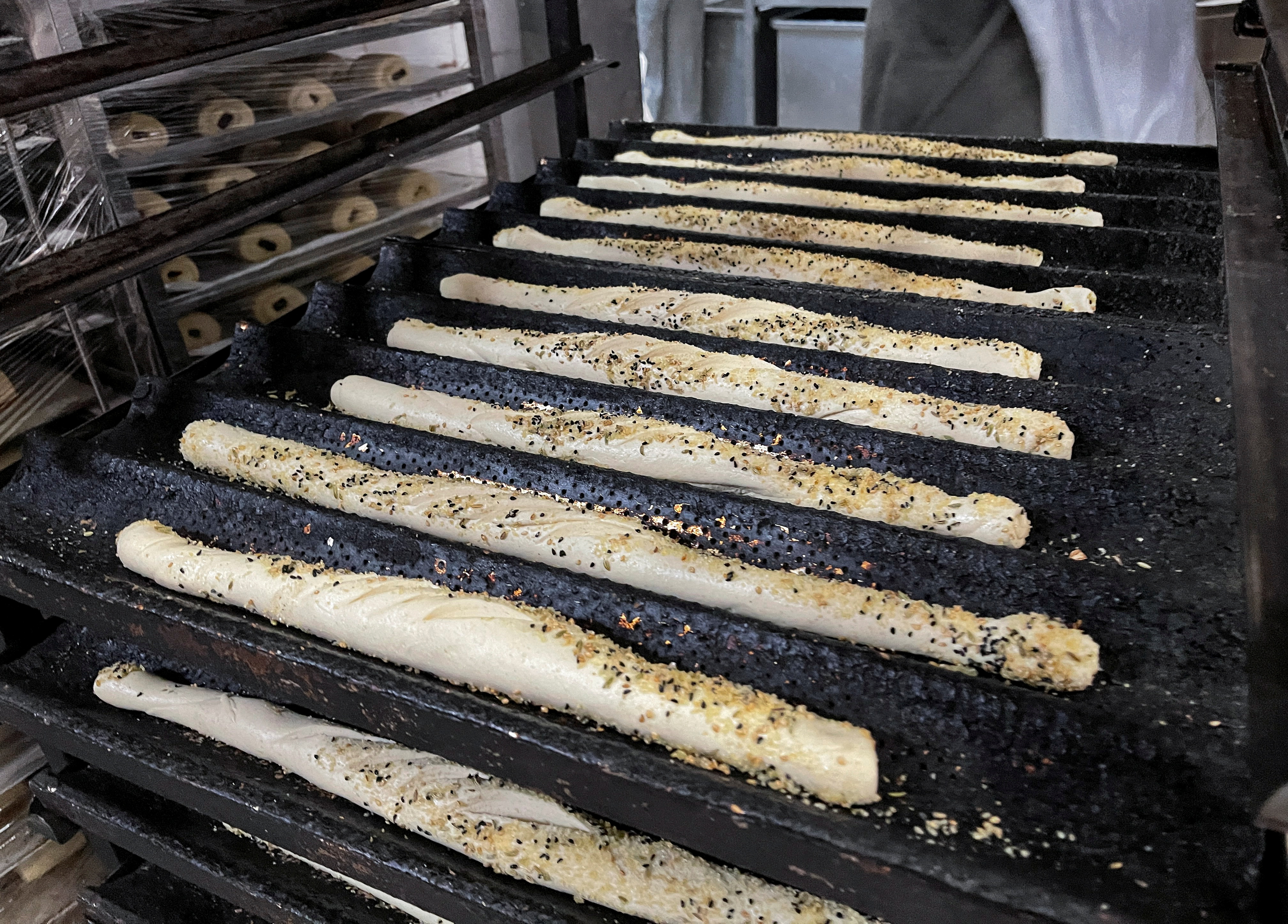 Trays with prepared baguette dough