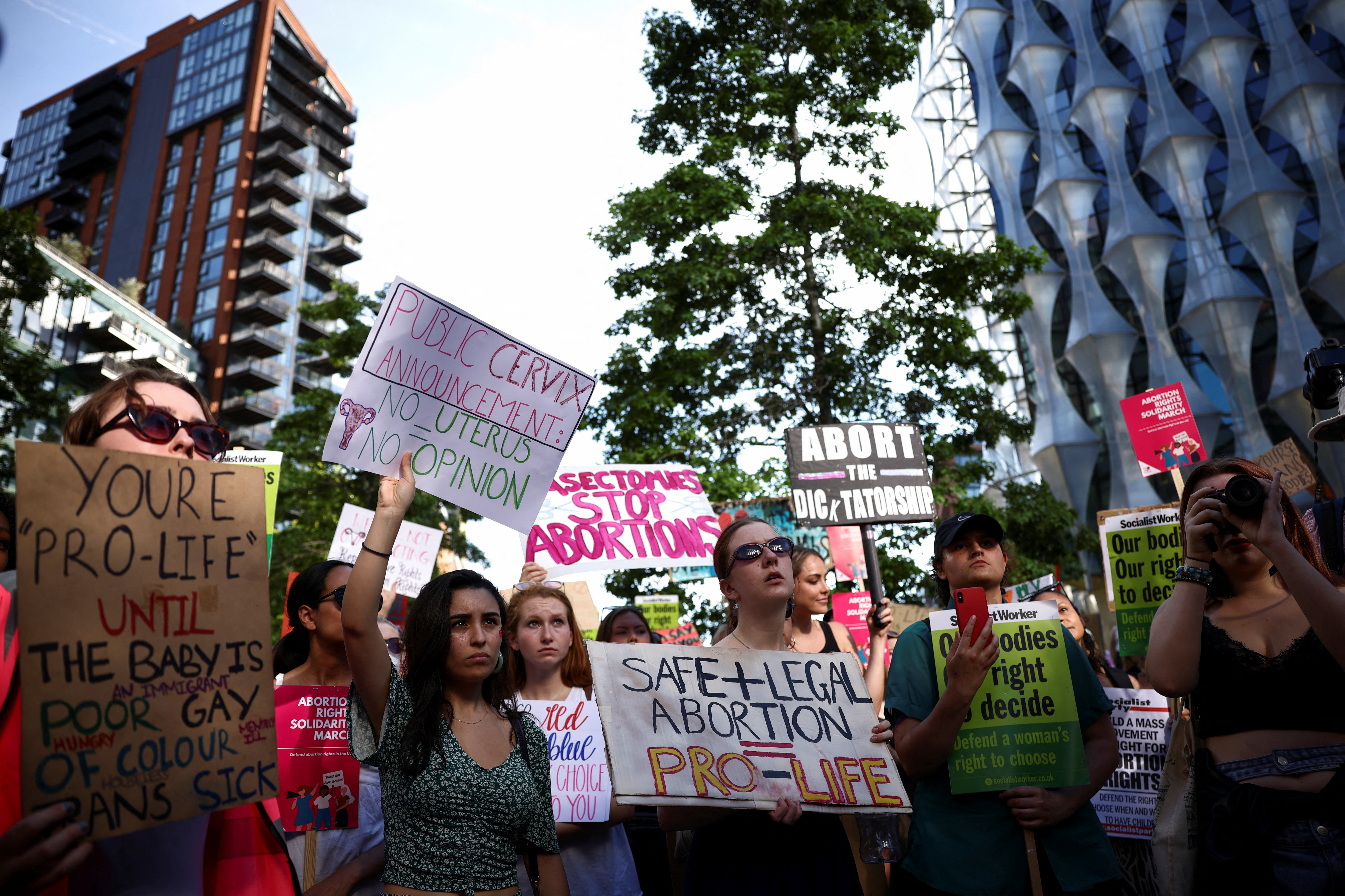 Protesters hold banners during Abortion Rights Solidarity demonstration, after the U.S. Supreme Court overturned Roe v Wade decision that legalised abortion, outside the U.S. embassy in London, Britain July 9, 2022. REUTERS/Henry Nicholls