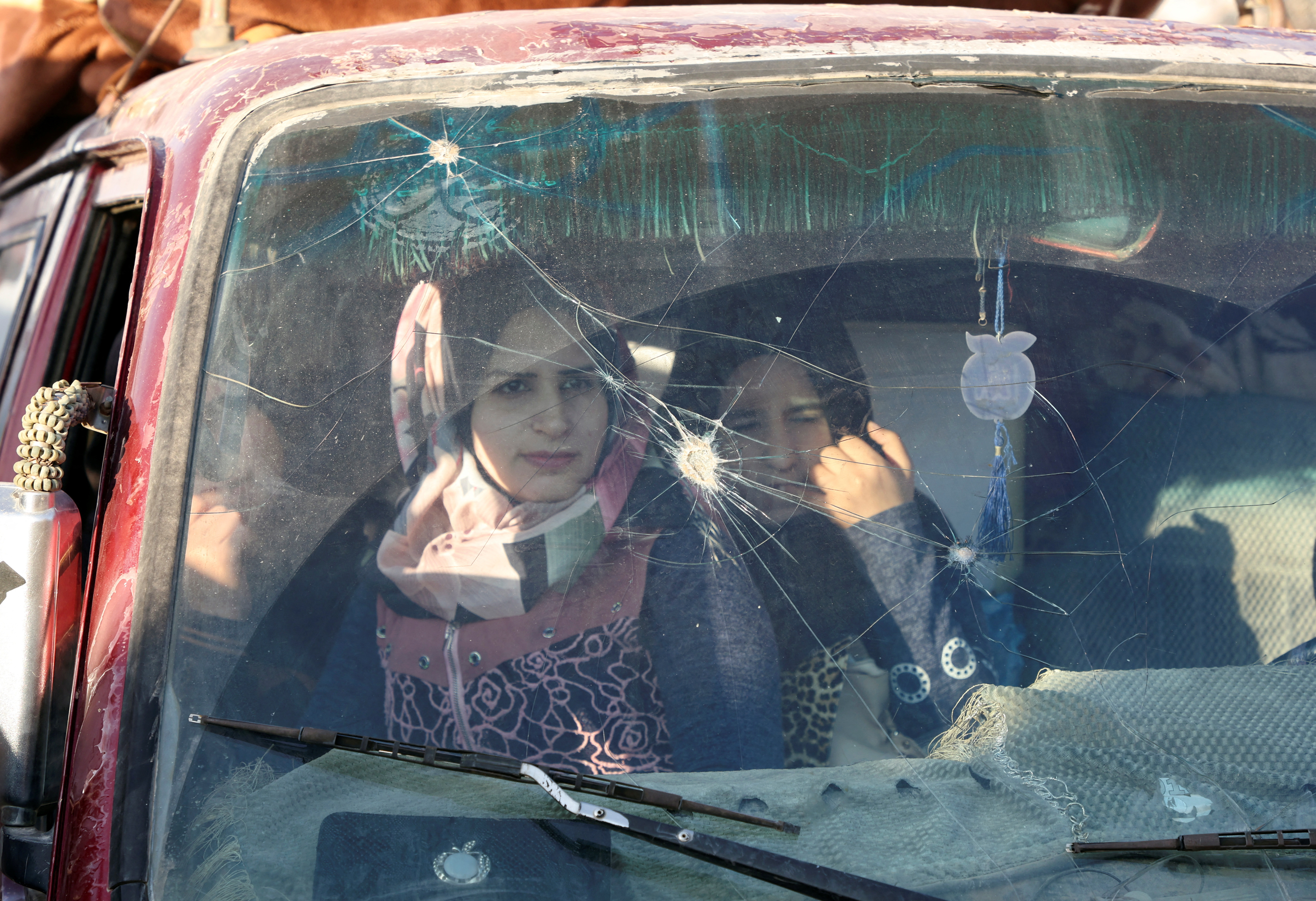 Syrian refugees sit inside a vehicle as they prepare to return to Syria from Wadi Hmayyed, on the outskirts of the Lebanese border town of Arsal, Lebanon October 26, 2022.