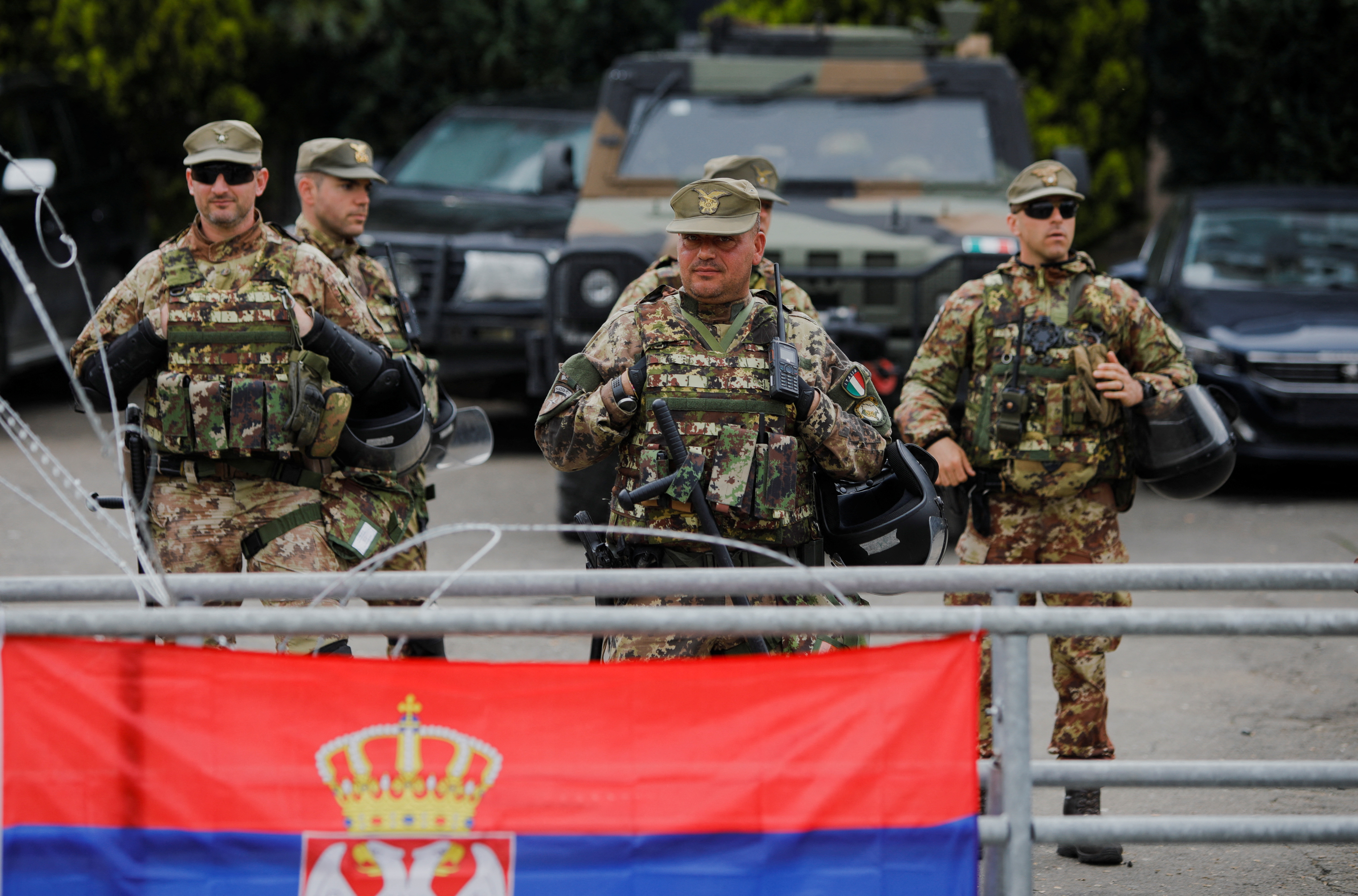 Italian members of the NATO-led Kosovo Force (KFOR) stand guard in Leposavic, Kosovo