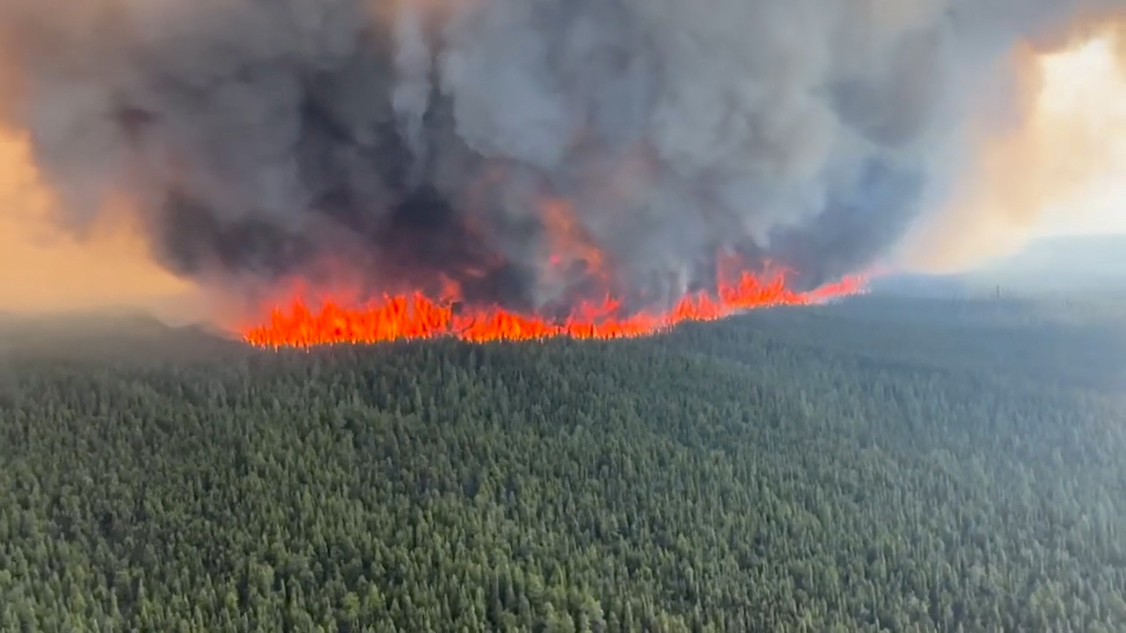 Smoke rises from a wildfire in Tumbler Ridge, British Columbia, Canada,