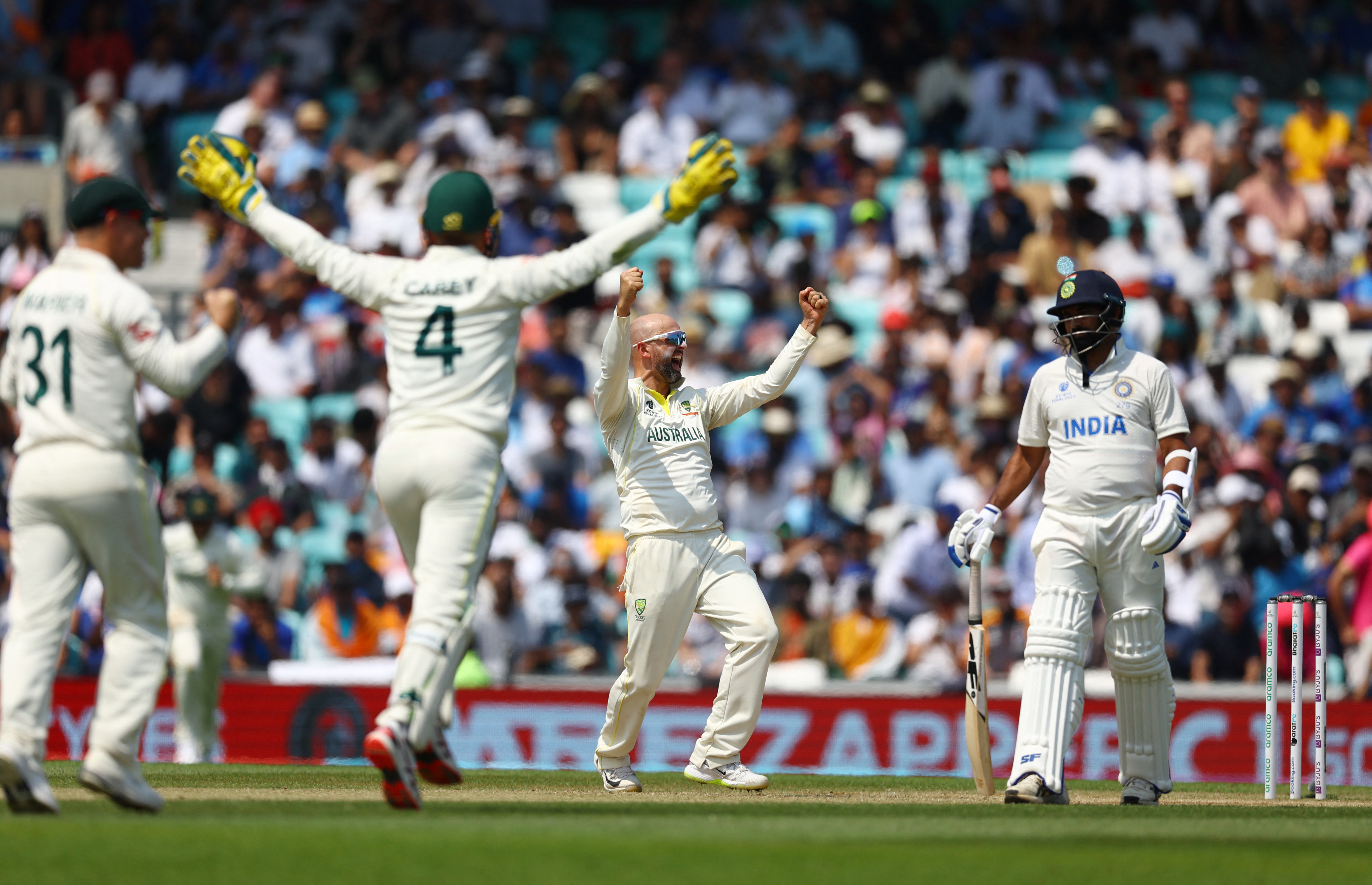 Australia's Nathan Lyon celebrates after taking the wicket of India's Mohammed Siraj to win the World Test Championship final