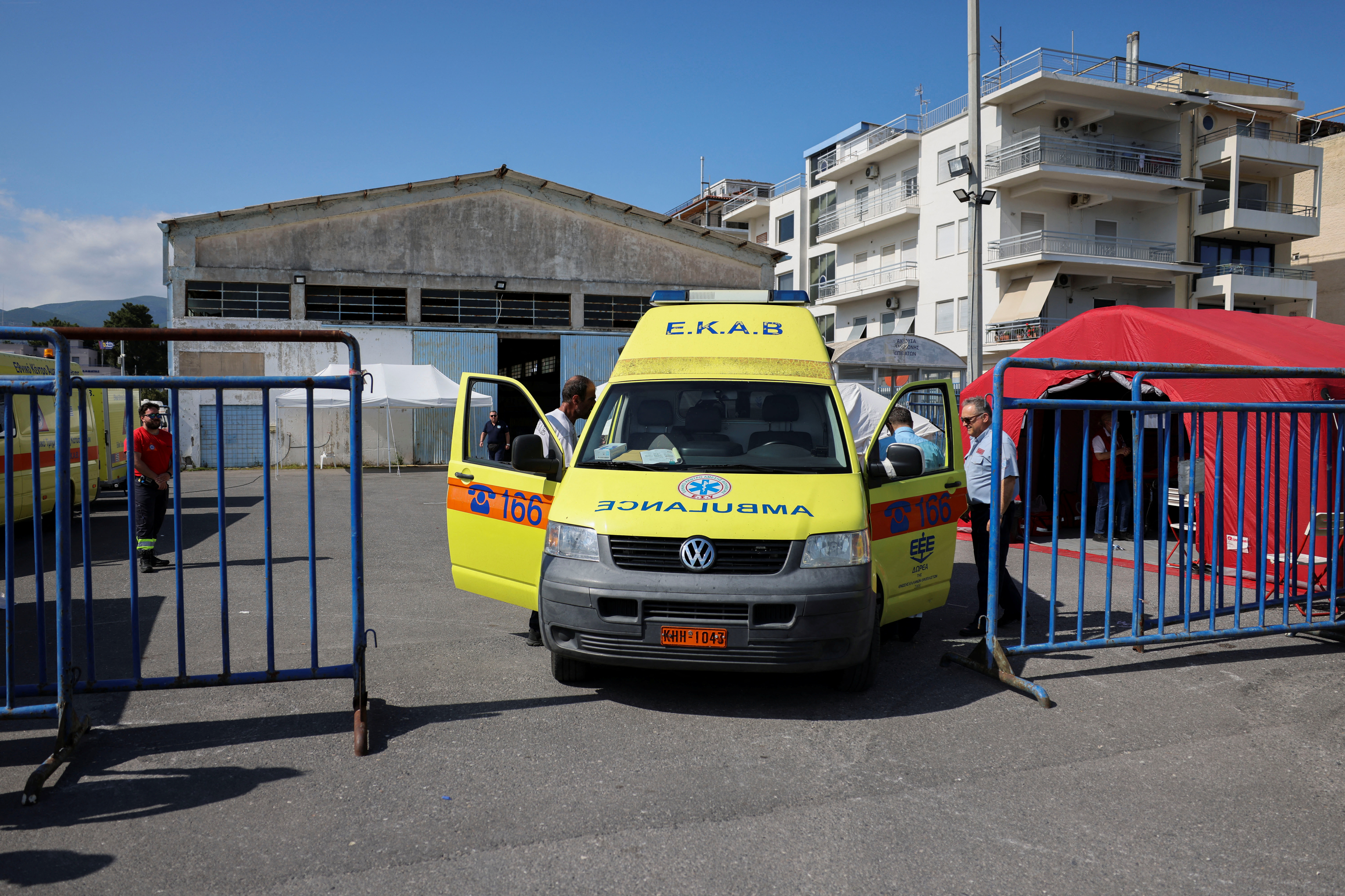 An ambulance is seen outside a shelter where migrants were transferred