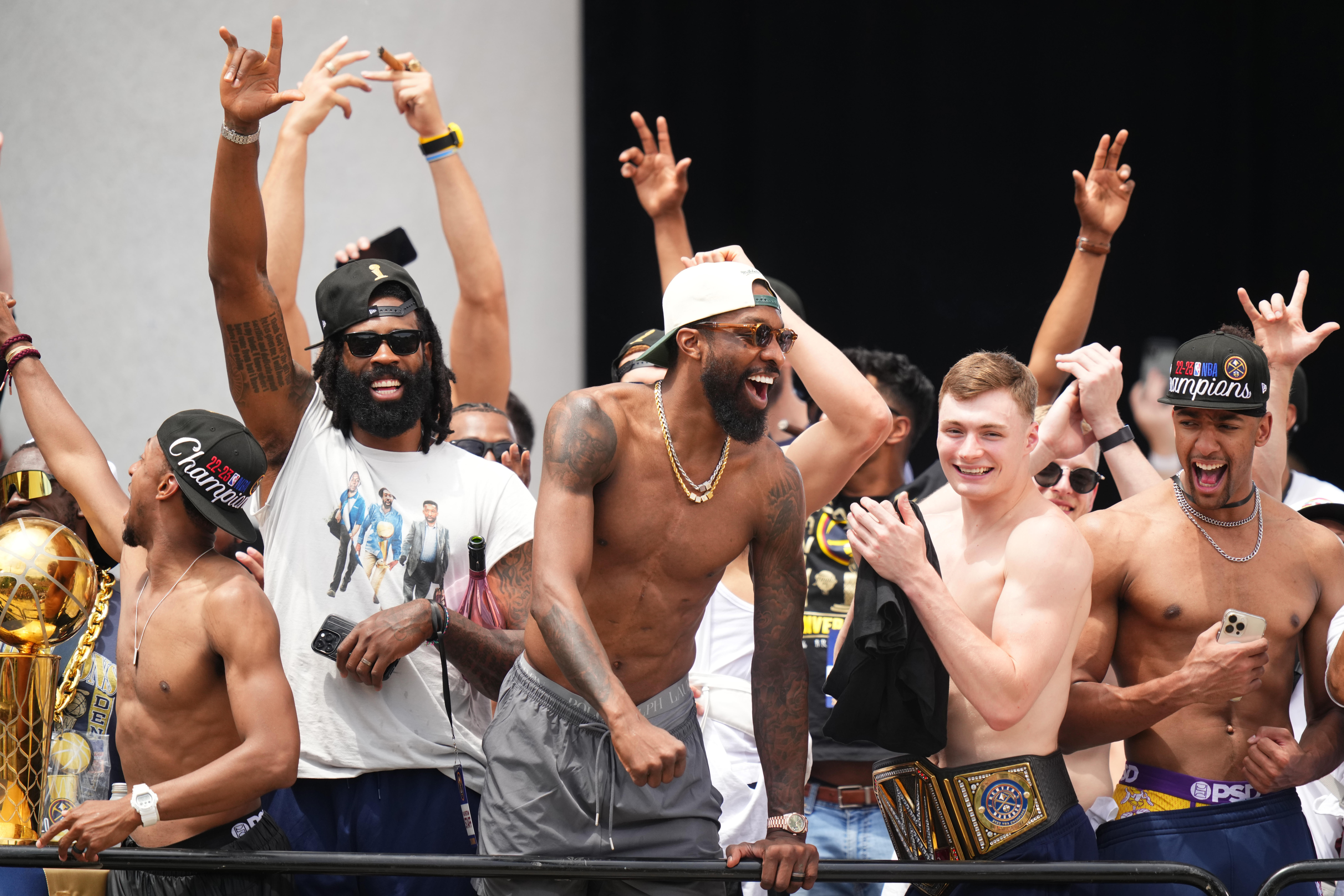 Denver Nuggets players celebrate during the championship parade after the Denver Nuggets won