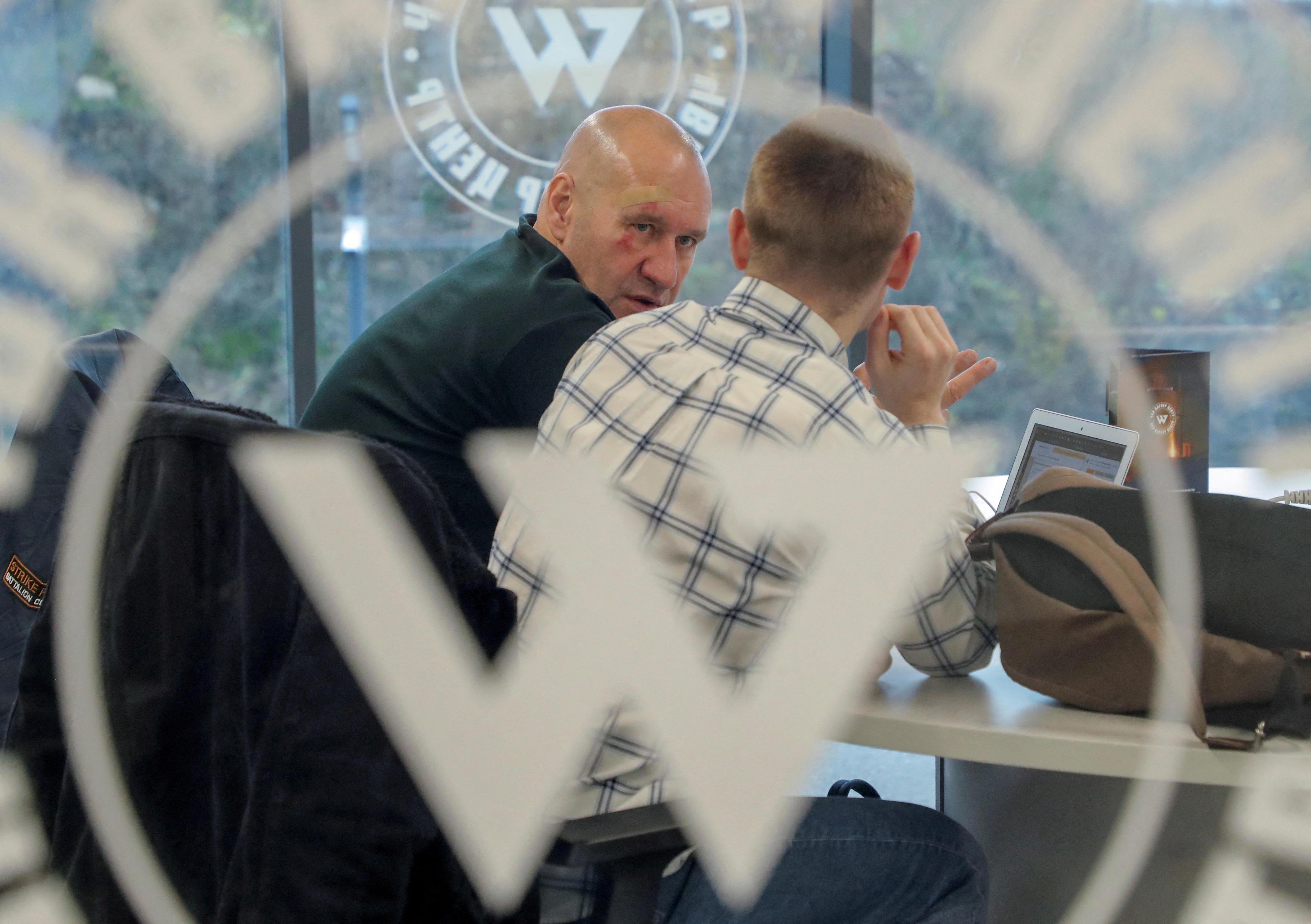 Men speak inside PMC Wagner Centre