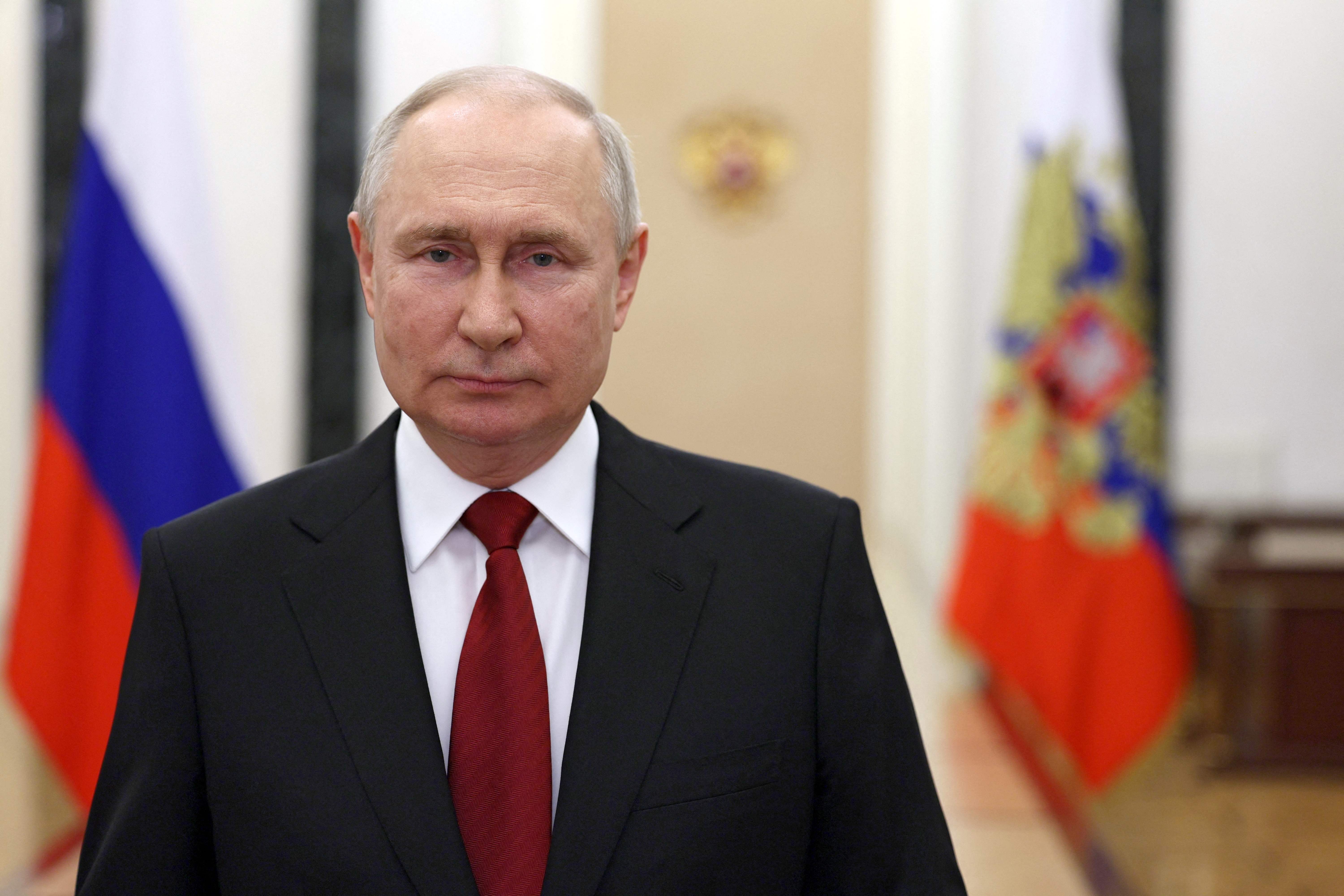 Russian President Vladimir Putin delivers a video address