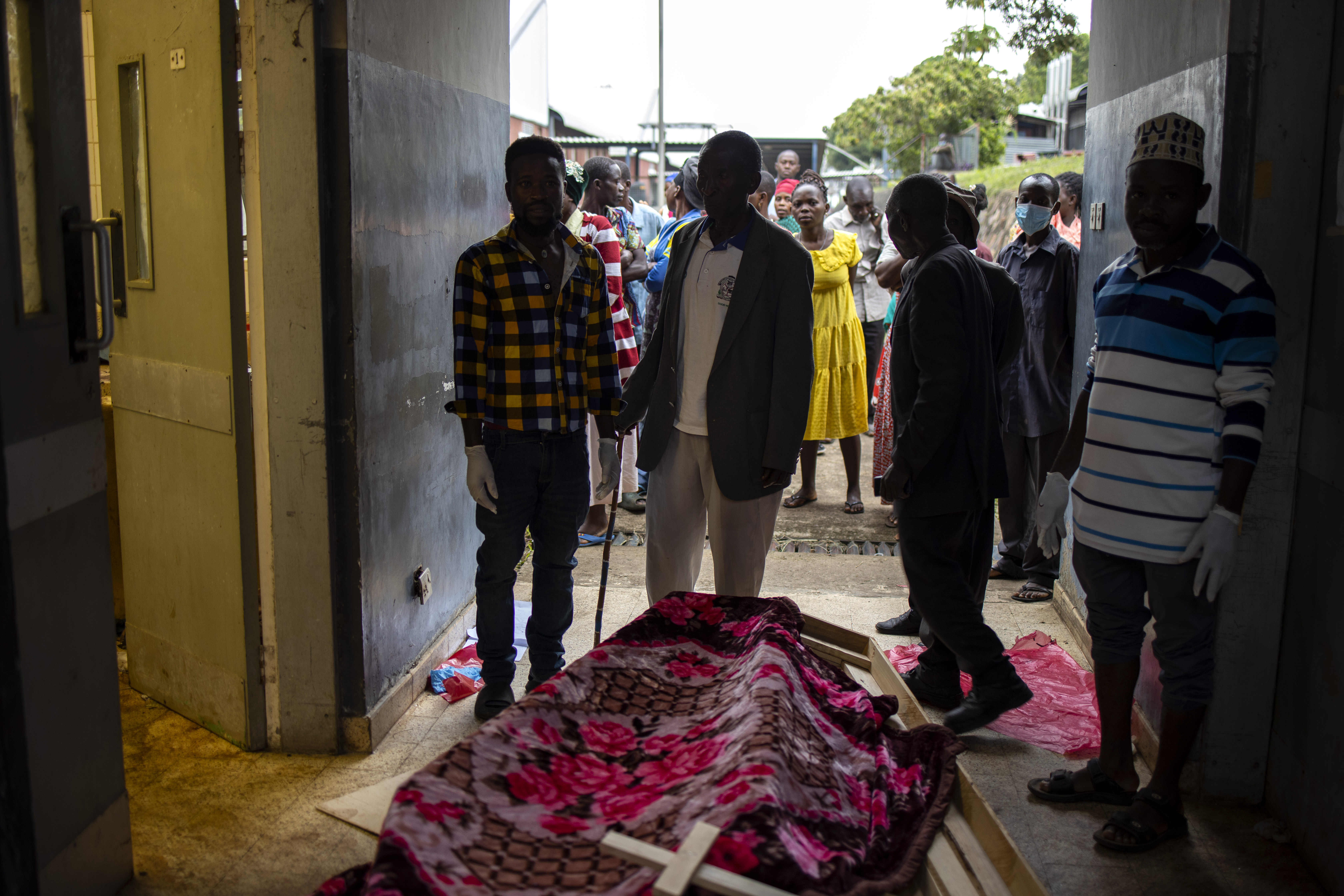 Relatives of victims of the Mpondwe Lhubiriha Secondary School gather at the Bwera General Hospital Mortuary,