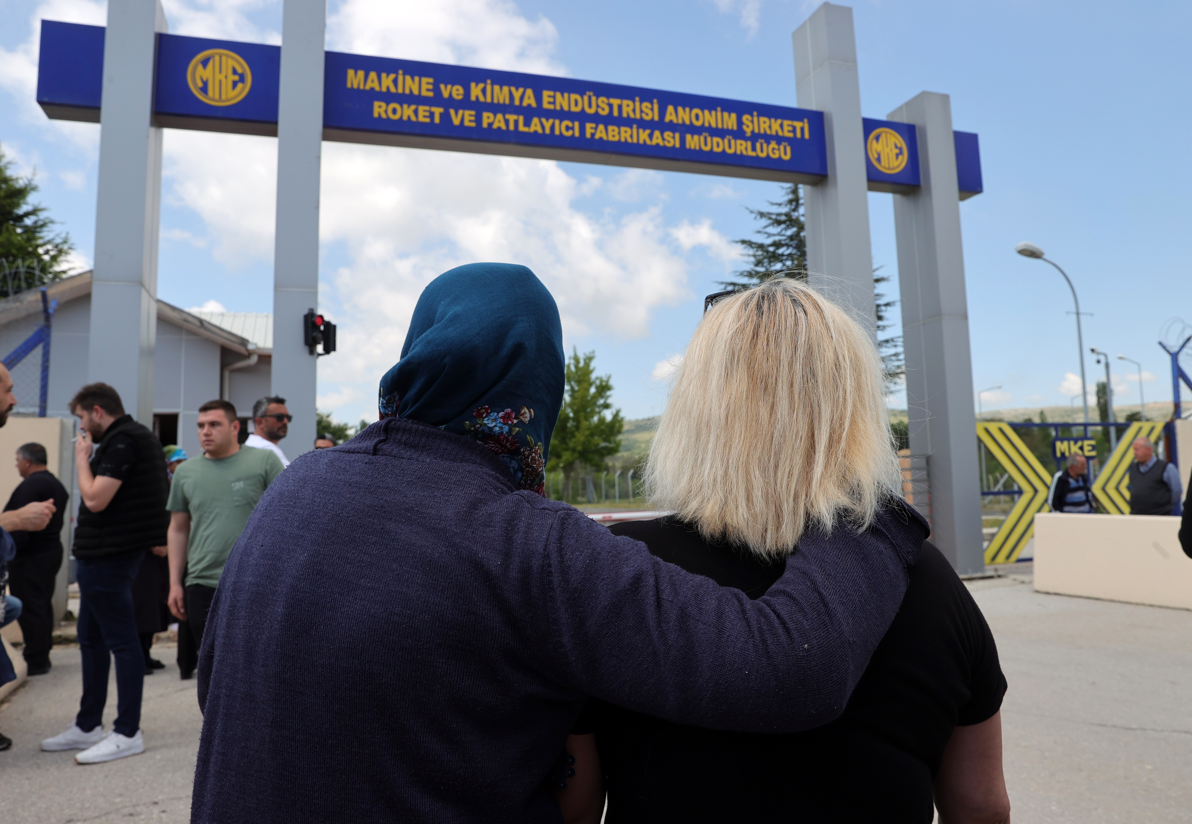 Relatives wait outside factory in Ankara after explosion