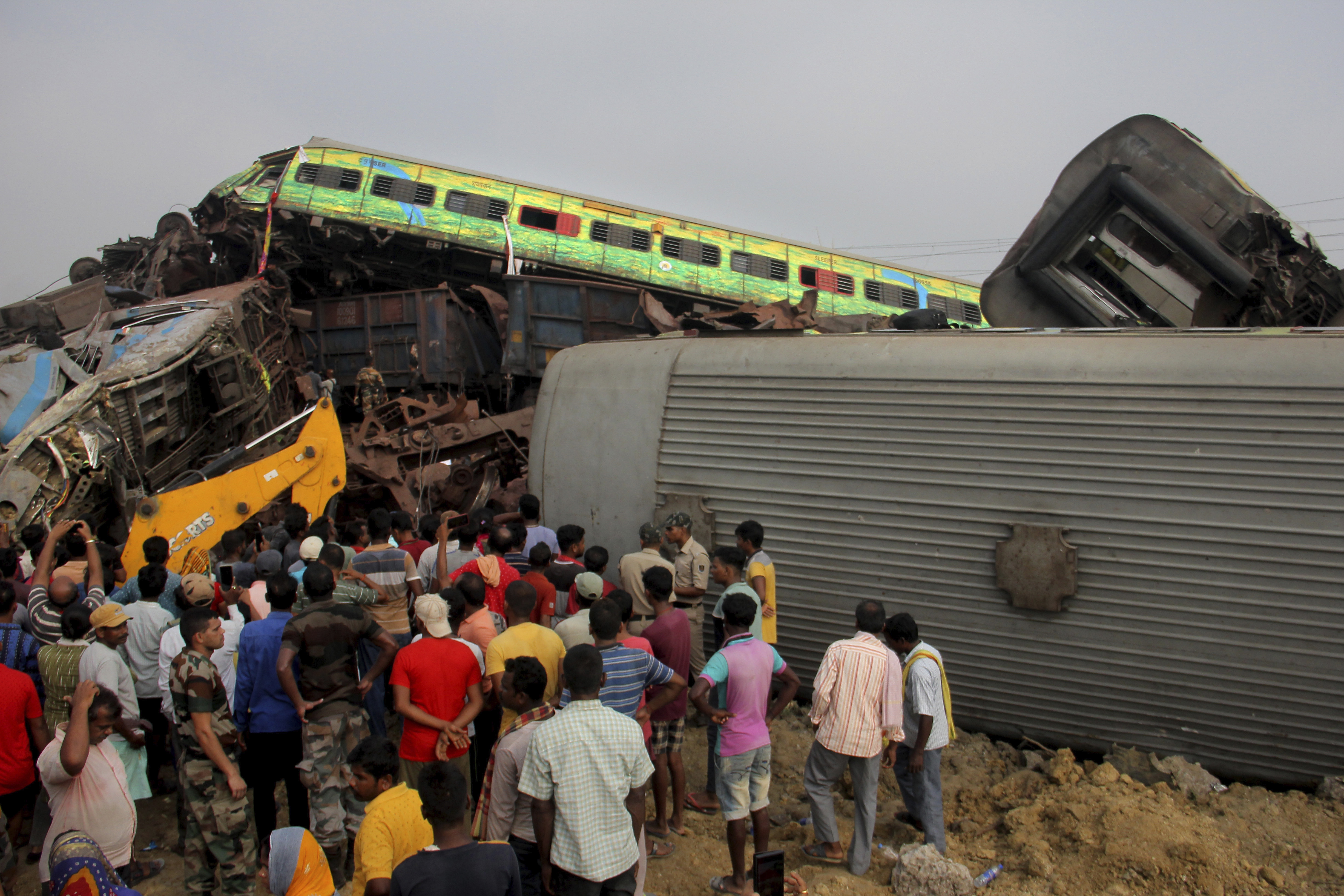 Rescuers work at the site of passenger trains accident in Balasore district
