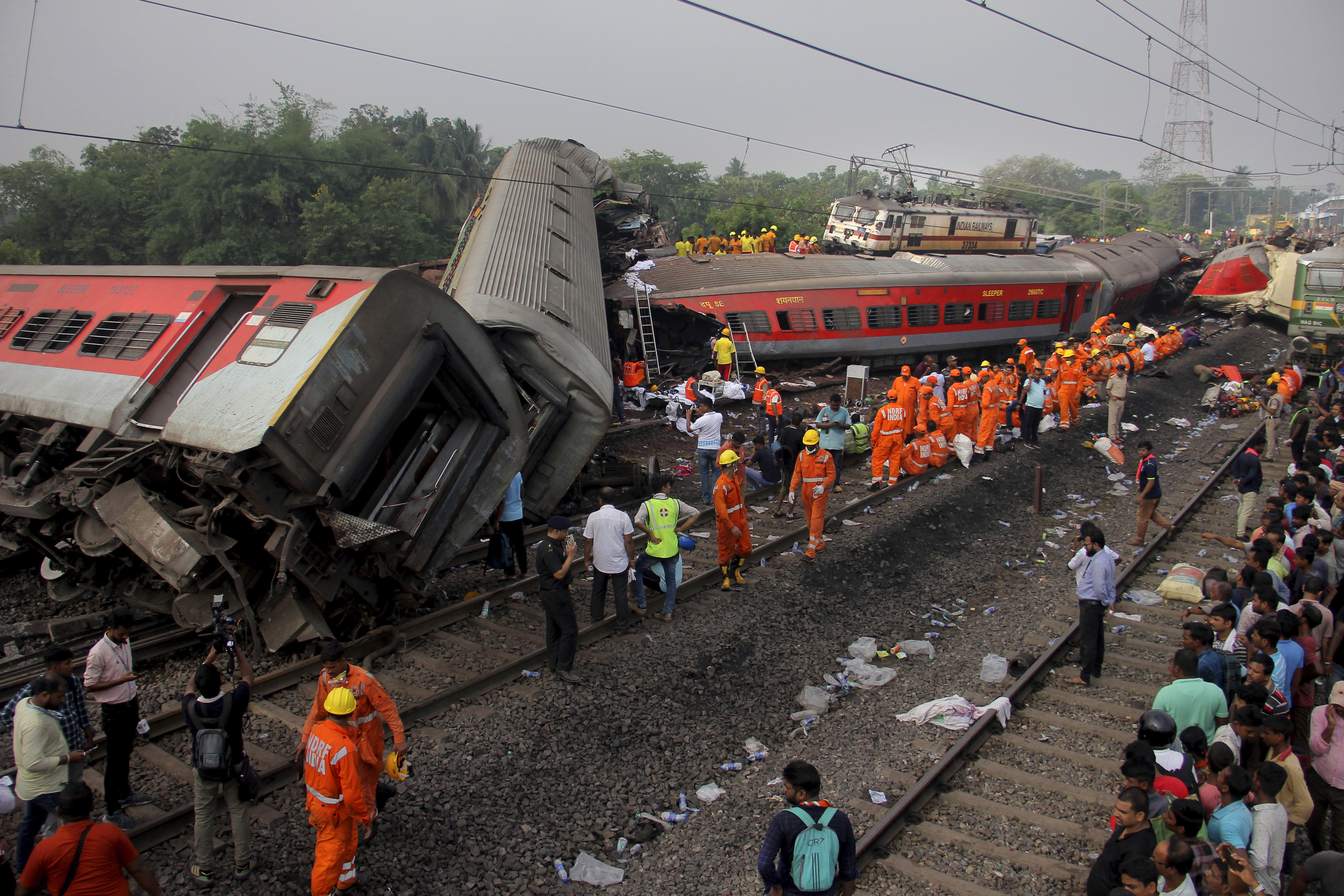 Rescuers work at the site of passenger trains accident in Balasore district