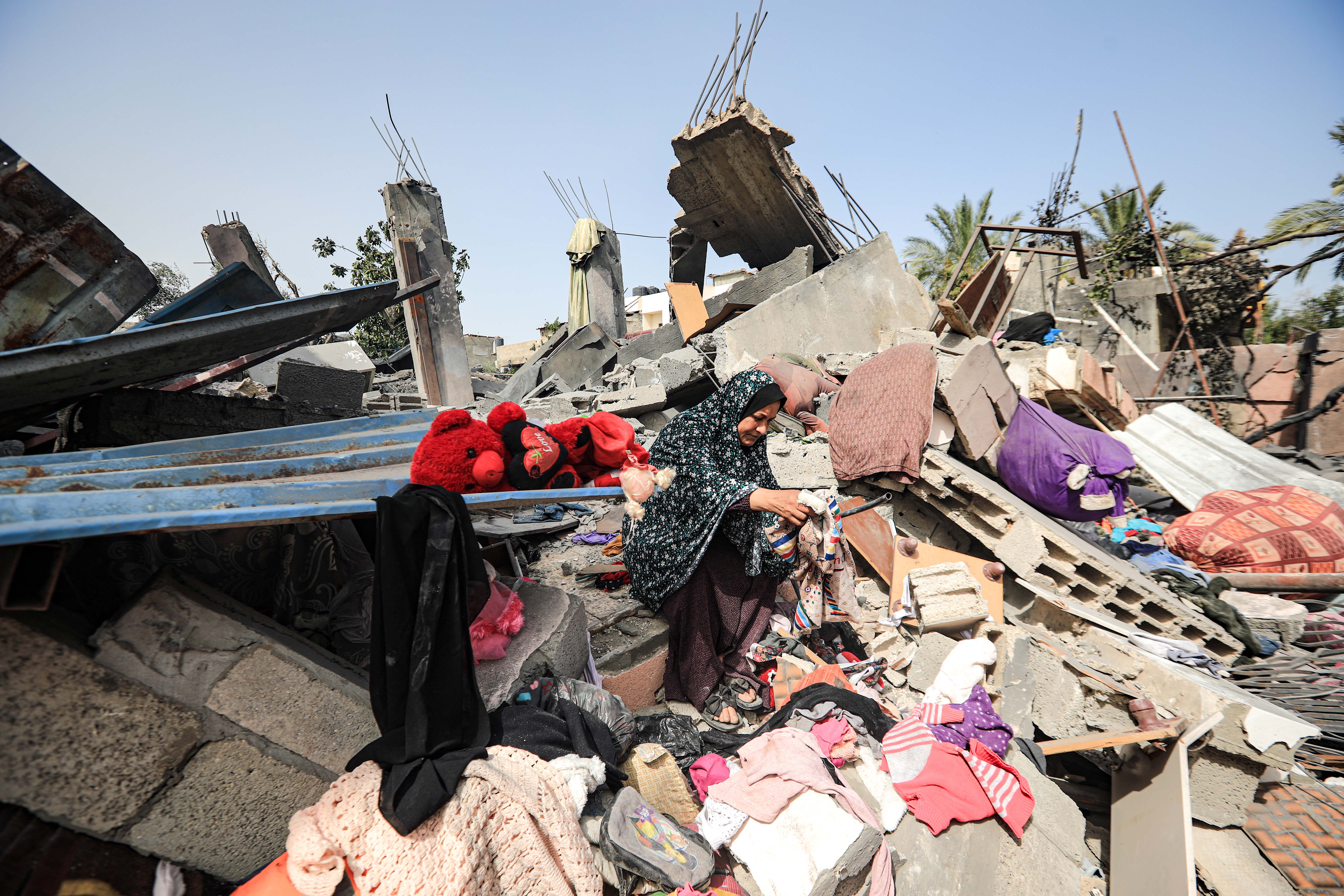 A woman on the her house rubble 