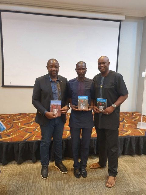Haggak in the middle flanked by Nigeria sports minister Sunday Dare (L) and publisher Enefiok Udo-Obong (R)