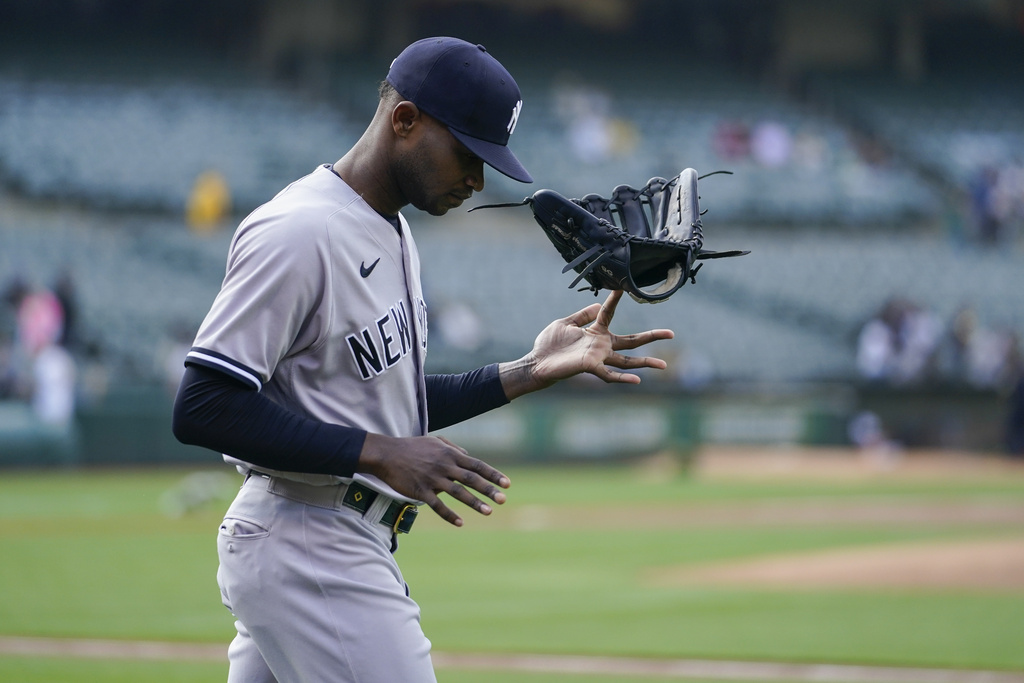 Domingo German tosses his glove