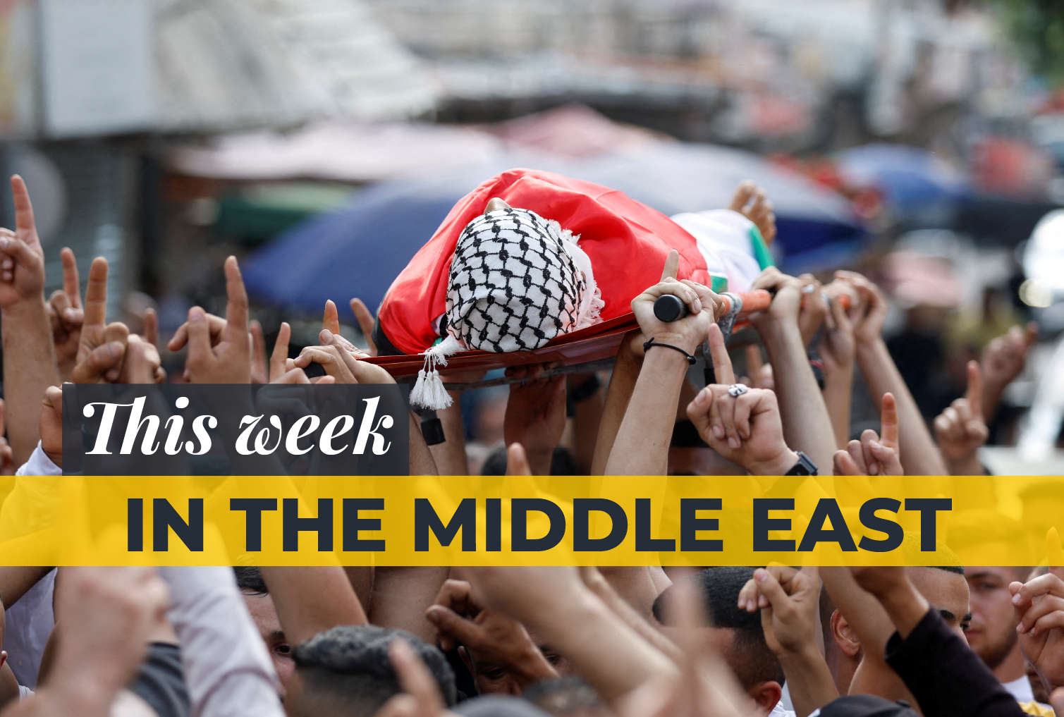Mourners carry the body of a Palestinian who was killed in an Israeli raid, during his funeral in Jenin