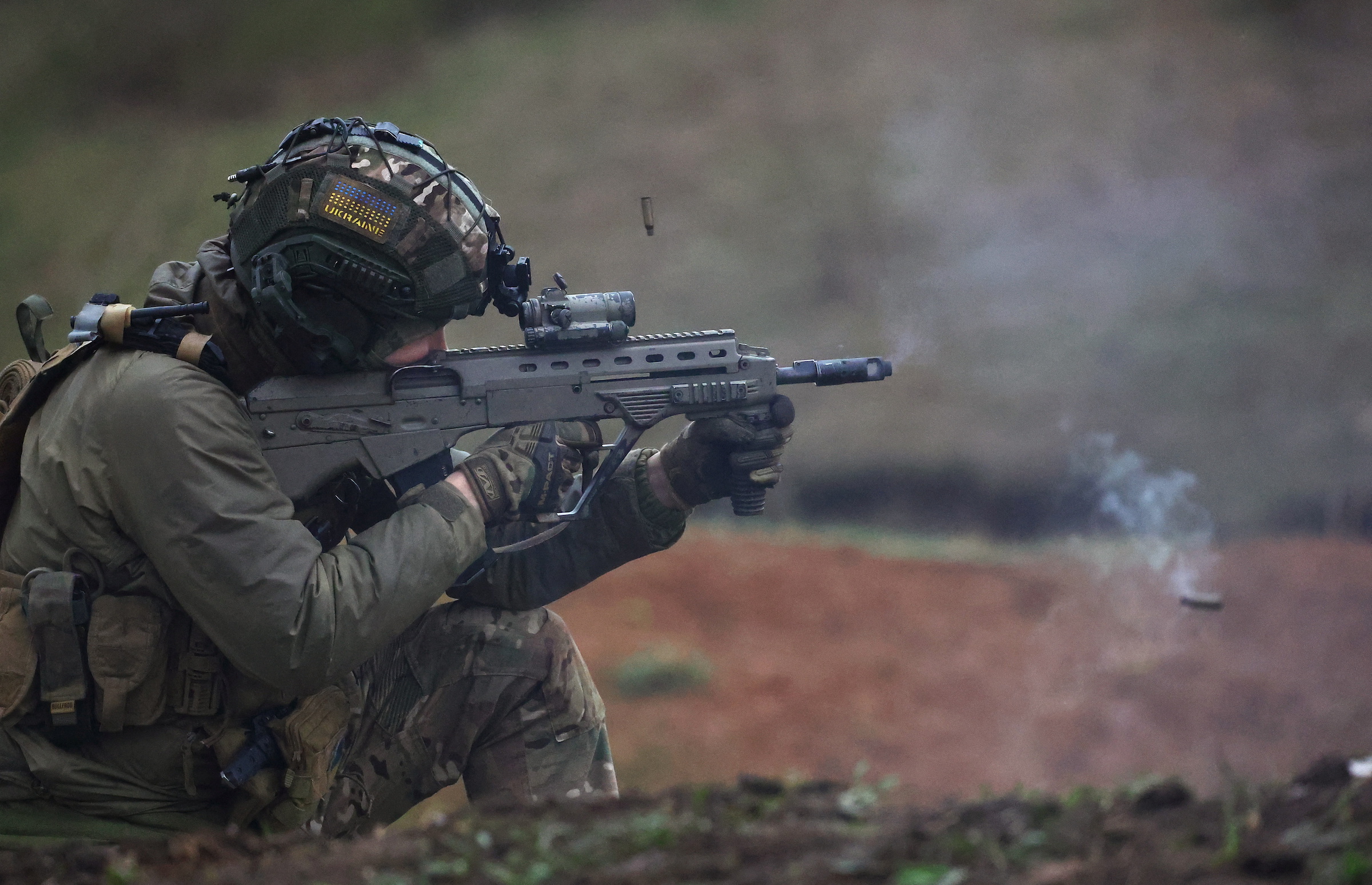 A member of the Ukrainian special force engages in zeroing his weapon prior to a mission.