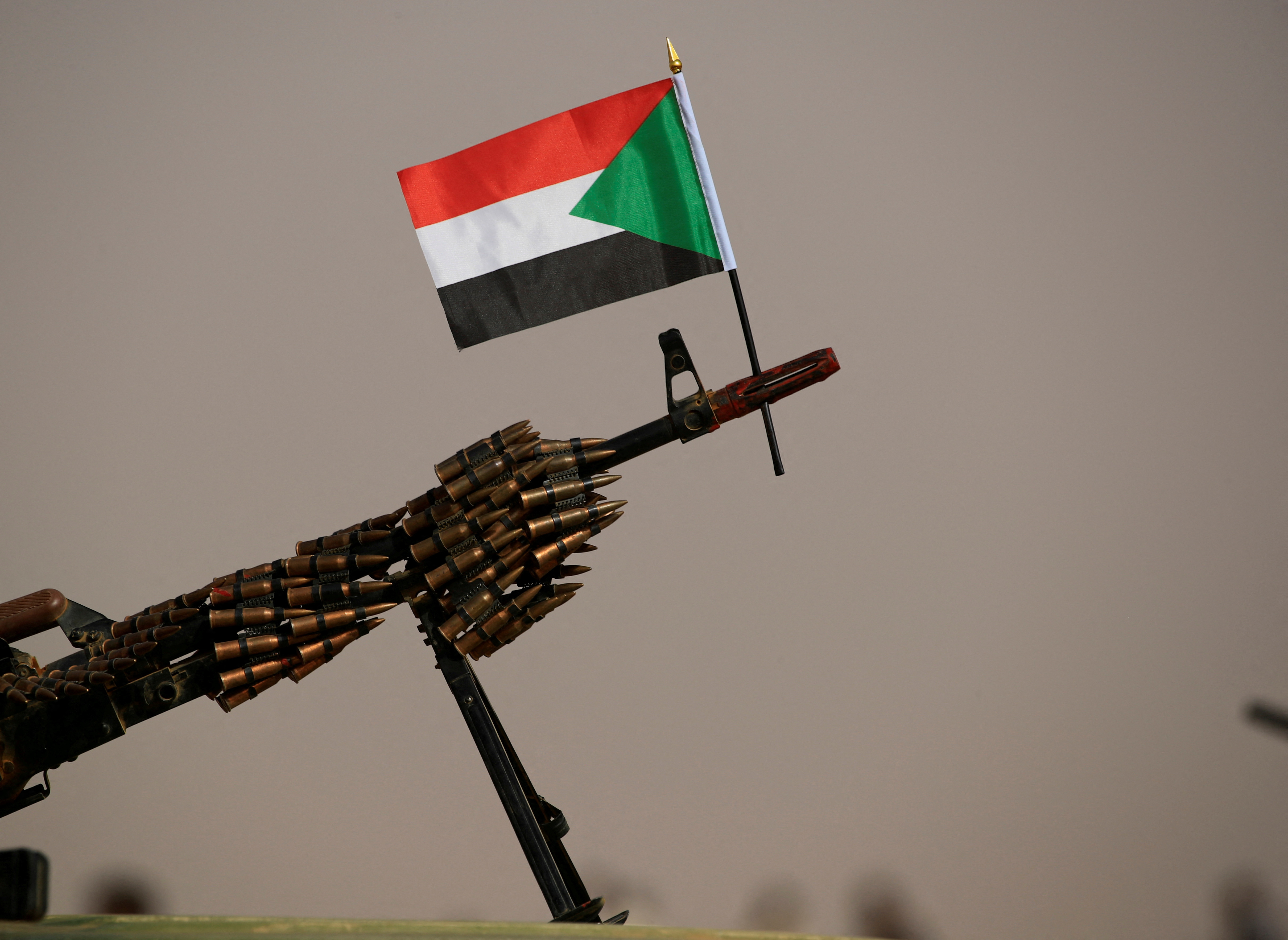 Sudanese national flag is attached to a machine gun of Paramilitary Rapid Support Forces (RSF) soldiers