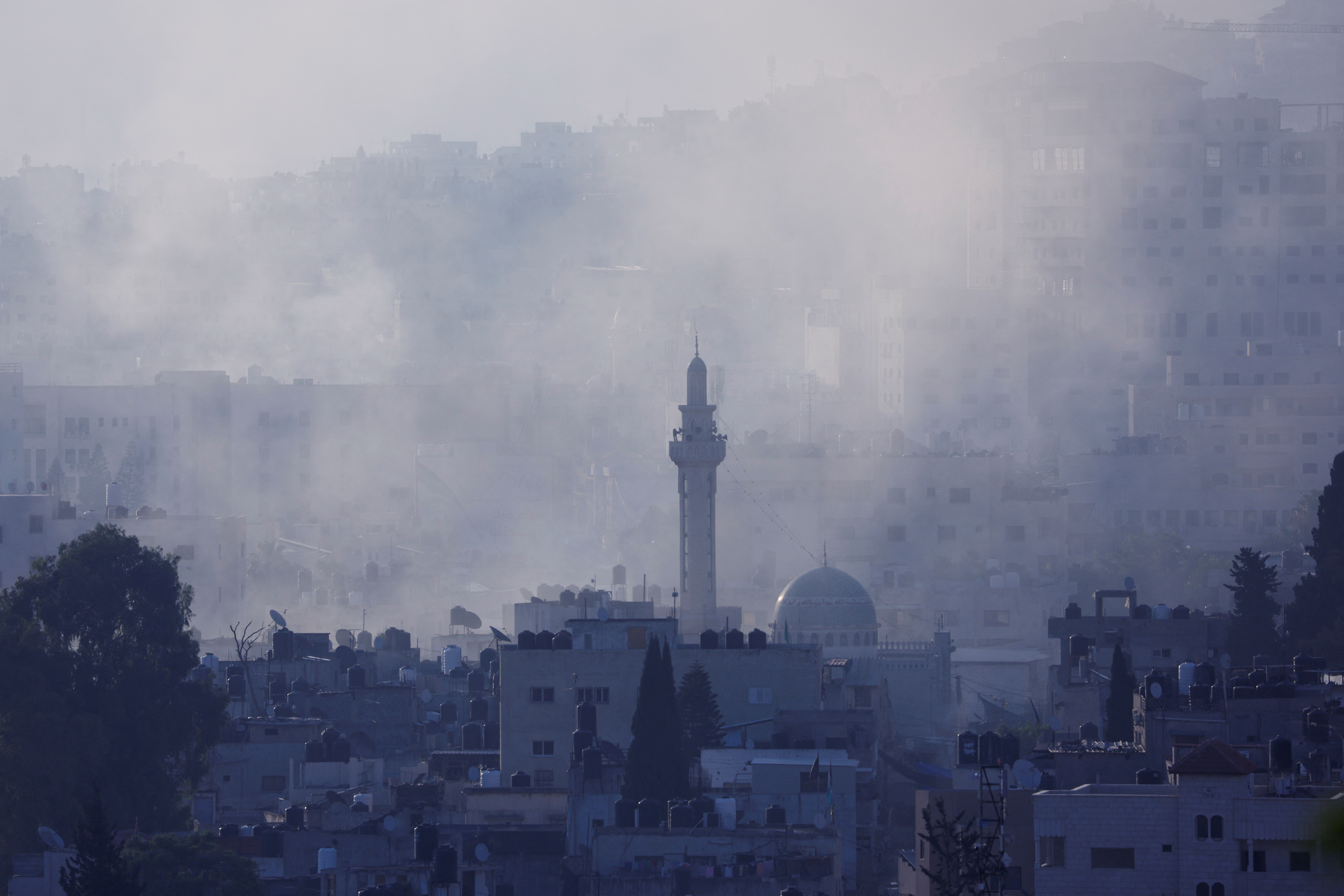 Smoke rises during an Israeli military raid