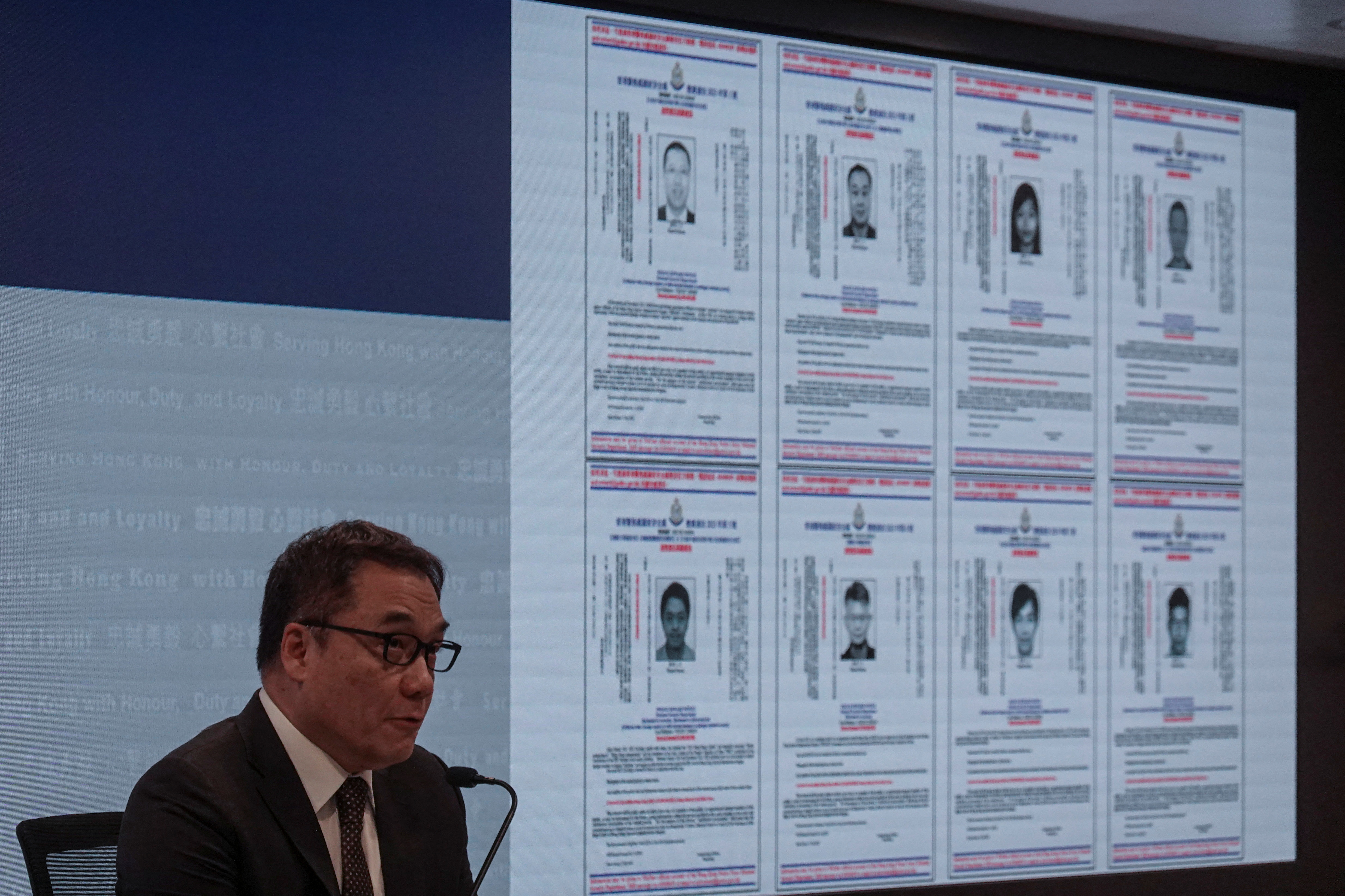 Hong Kong's police chief for national security announcing the bounties for the activists, legislators and lawyers.