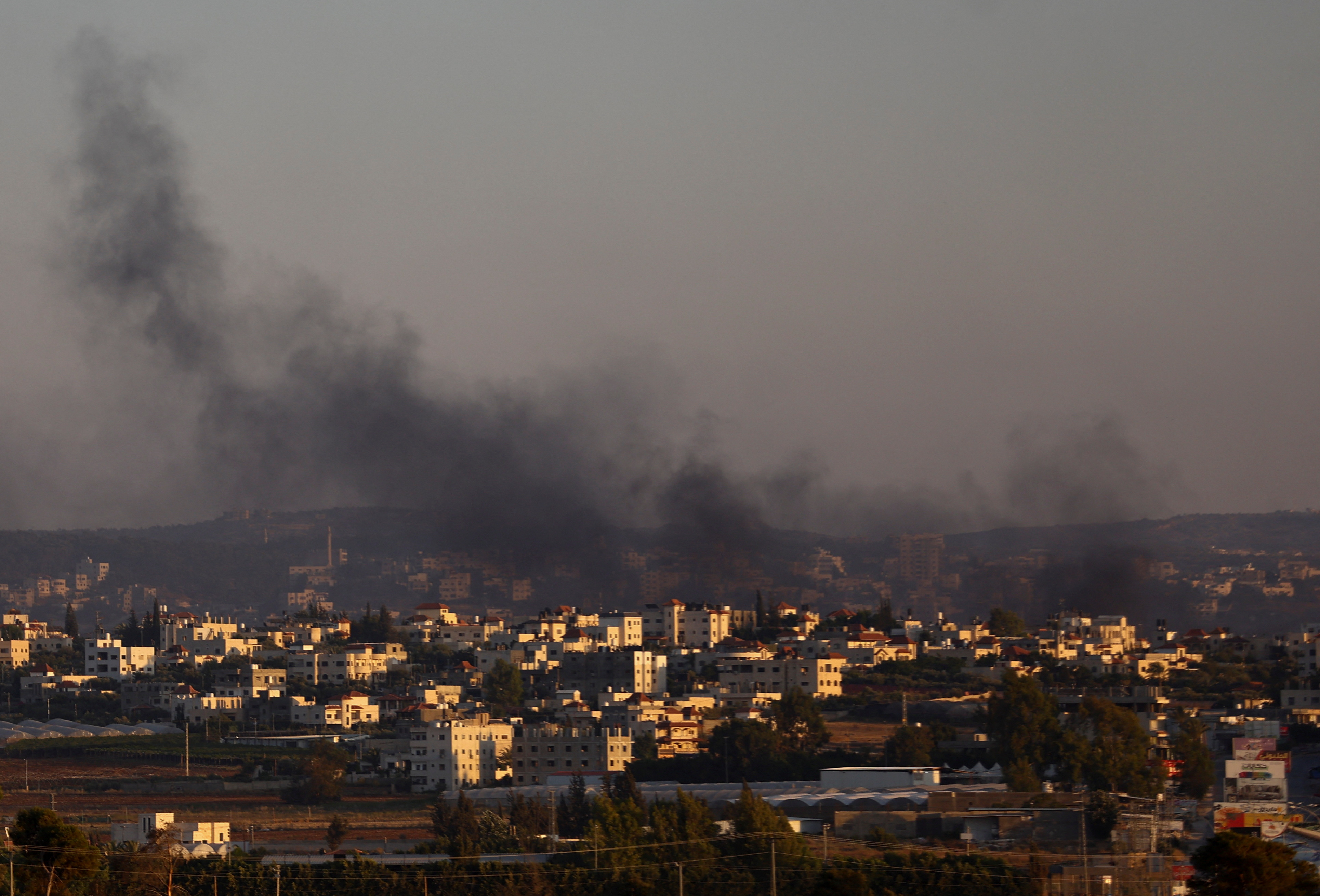 Smoke is seen from Israel's side during a raid on Jenin refugee camp in the Israeli-occupied West Bank