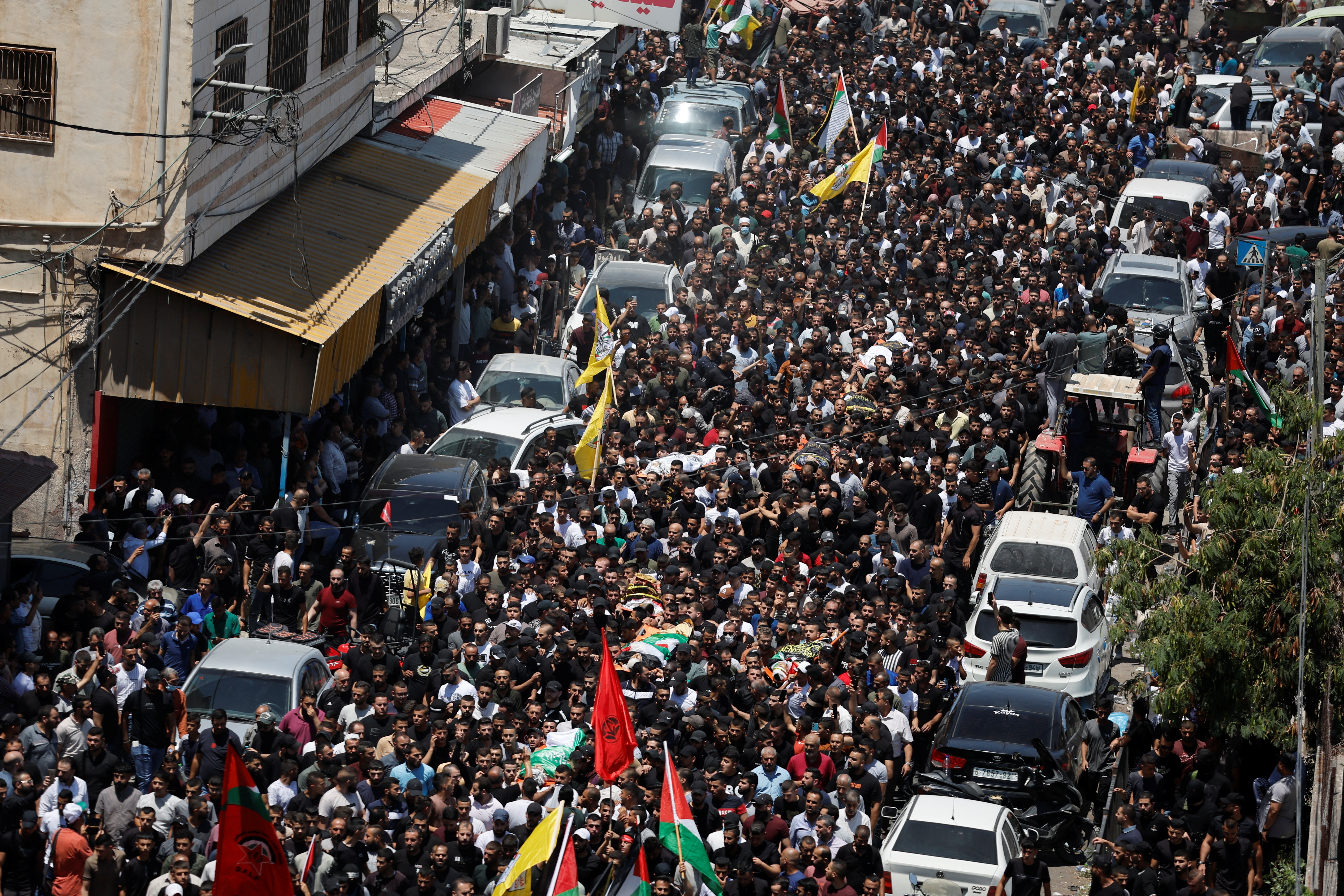 Mourners attend the funeral of Palestinians killed during an Israeli military operation, in Jenin in the Israeli-occupied West Bank.