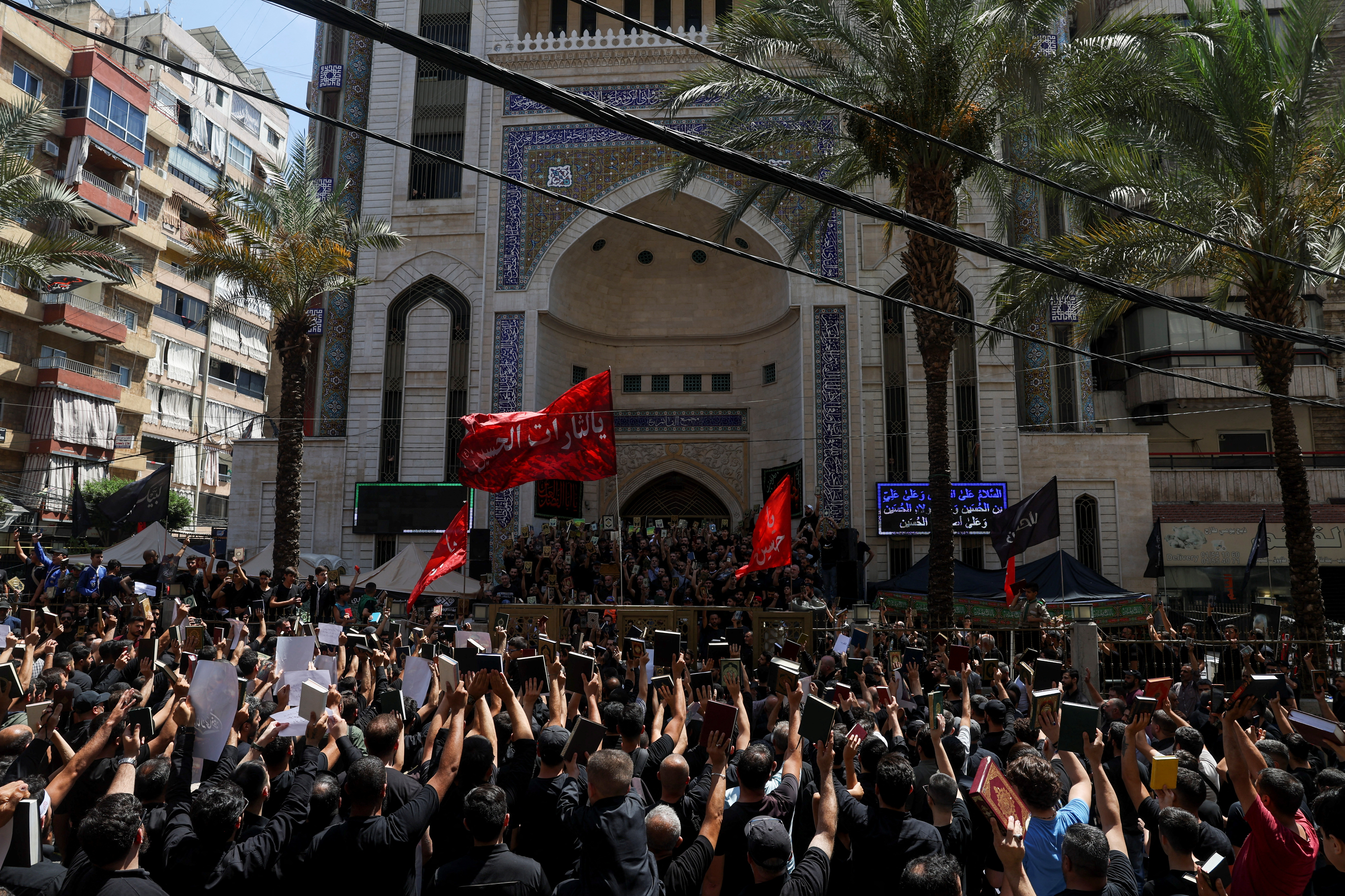 Lebanese Muslims participate in a demonstration called by the Shi'ite group Hezbollah