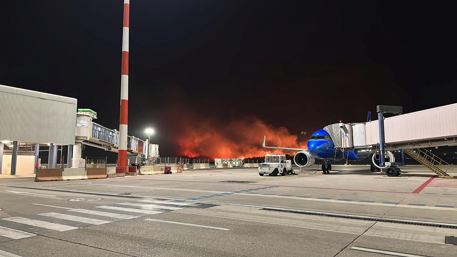 A wildfire burns near the Sicilian airport "Falcone-Borsellino" in Punta Raisi near Palermo