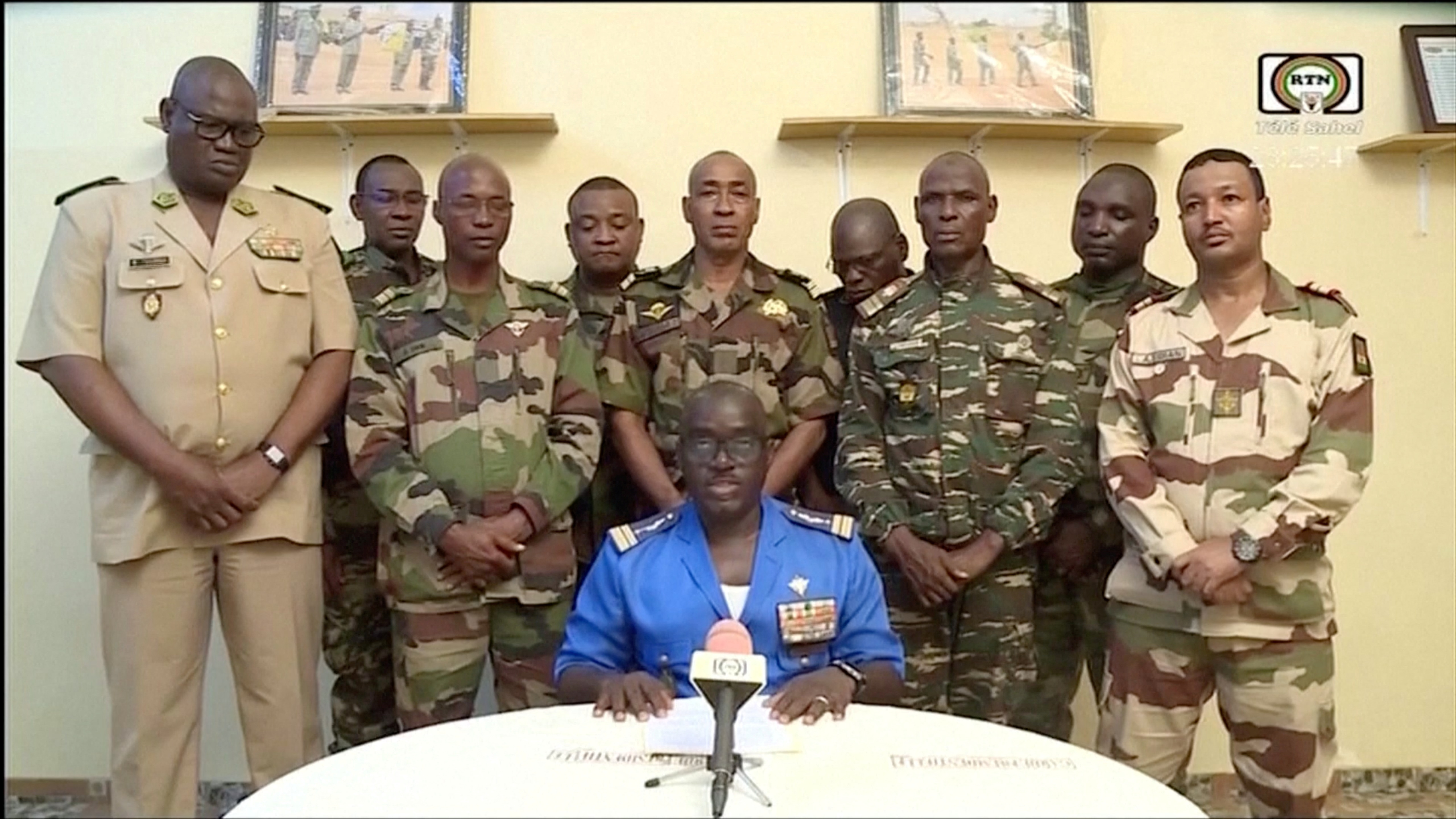 Niger Army spokesman Colonel Major Amadou Adramane speaks during an appearance on national television, after President Mohamed Bazoum was held in the presidential palace, in Niamey, Niger, July 26, 2023 in this still image taken from video.