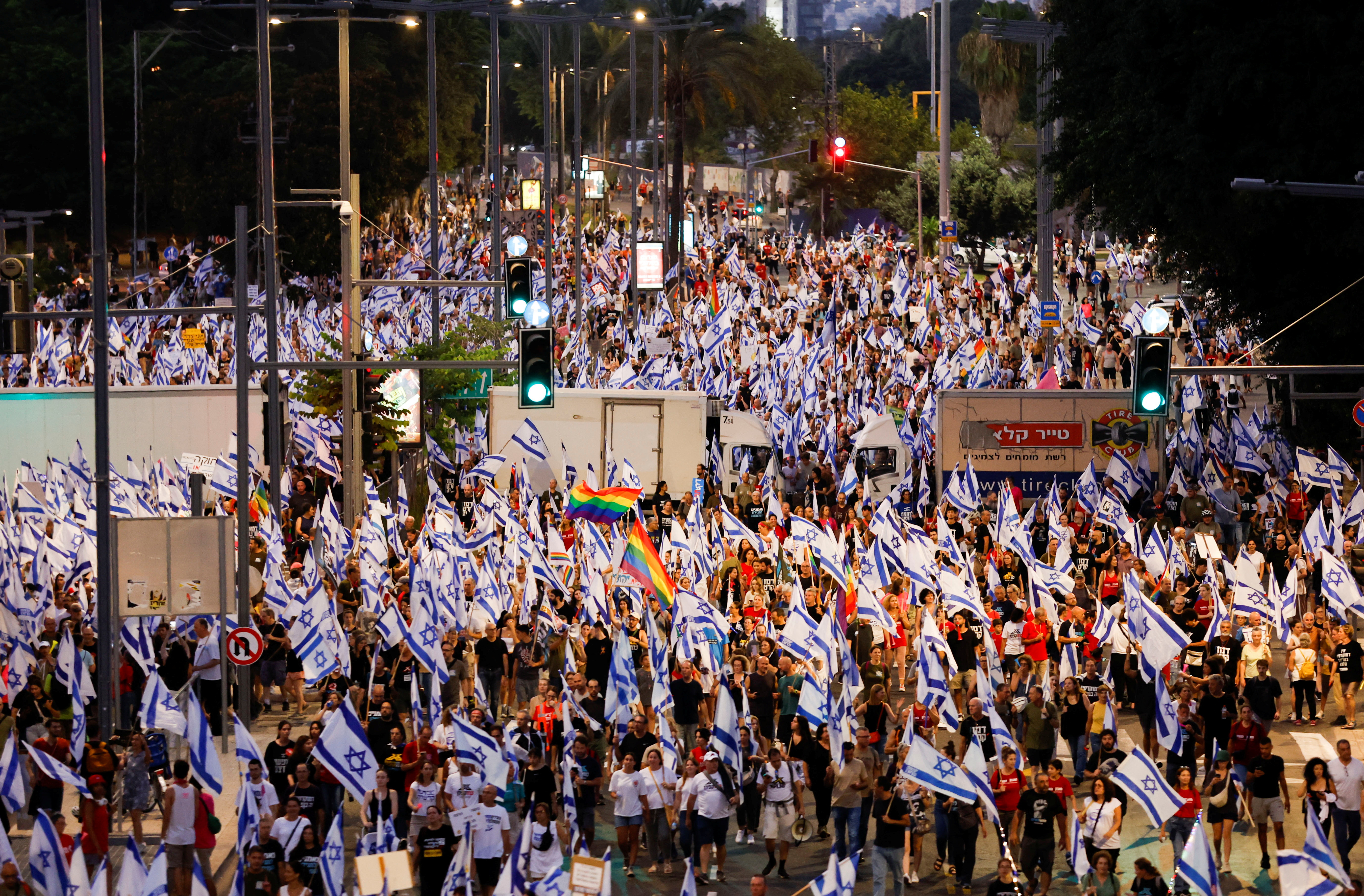 People take part in a demonstration against Israeli Prime Minister Benjamin Netanyahu