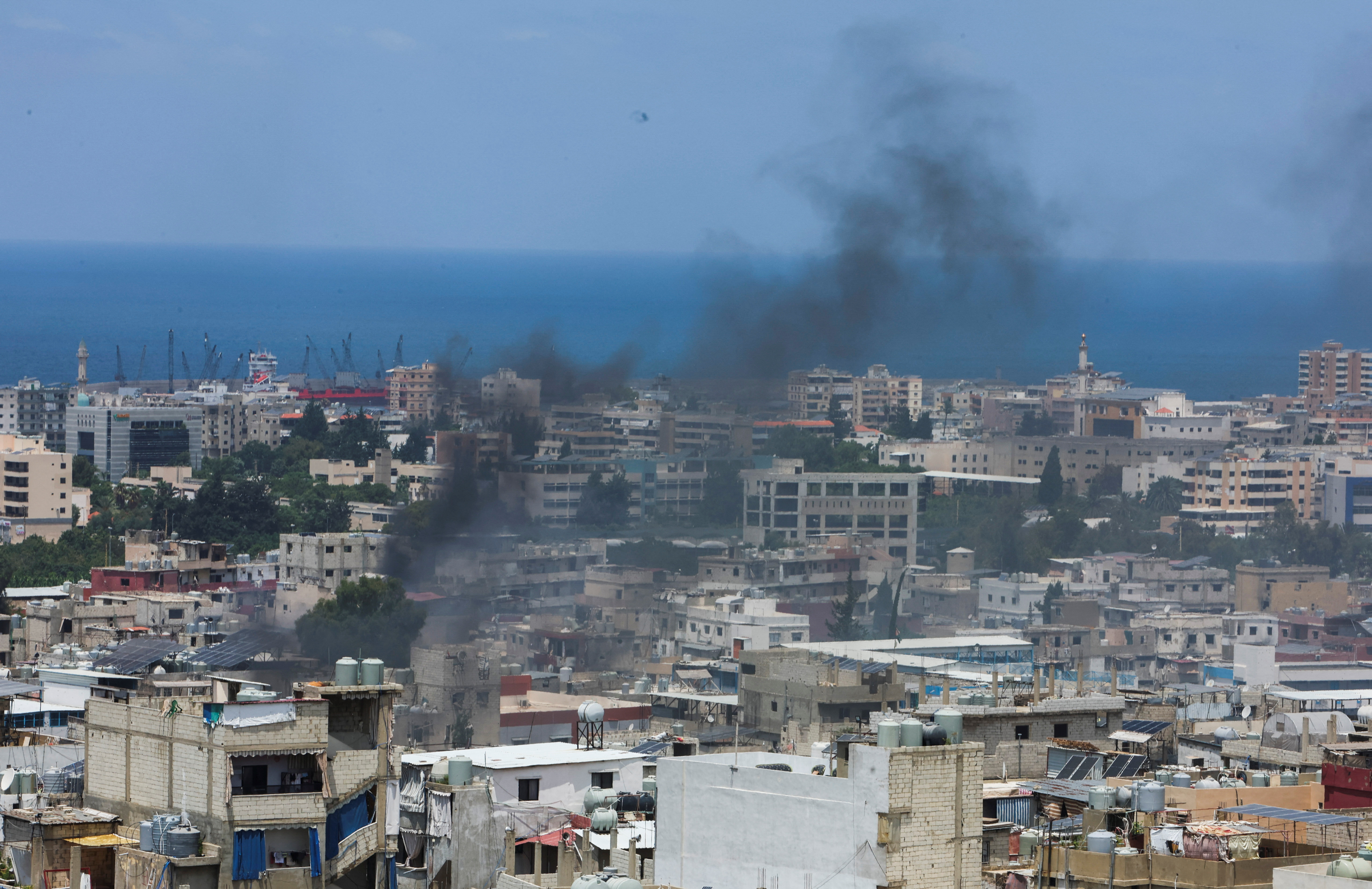 Smoke rises from Ain el-Hilweh Palestinian refugee camp during Palestinian faction clashes
