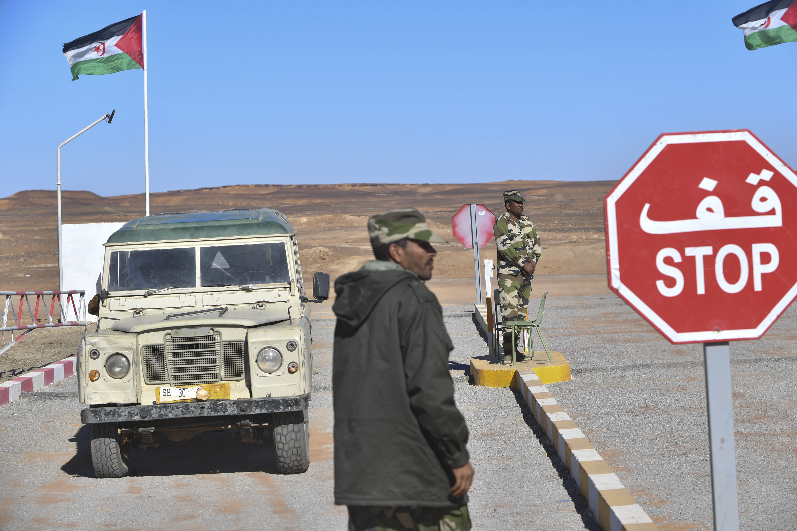 A flag of the Sahrawi Arab Democratic Republic, proclaimed by the separatist Polisario Front, flies at a checkpoint manned by Sahrawi security forces outside a refugee camp, about 170km southeast of the Algerian city of Tindouf