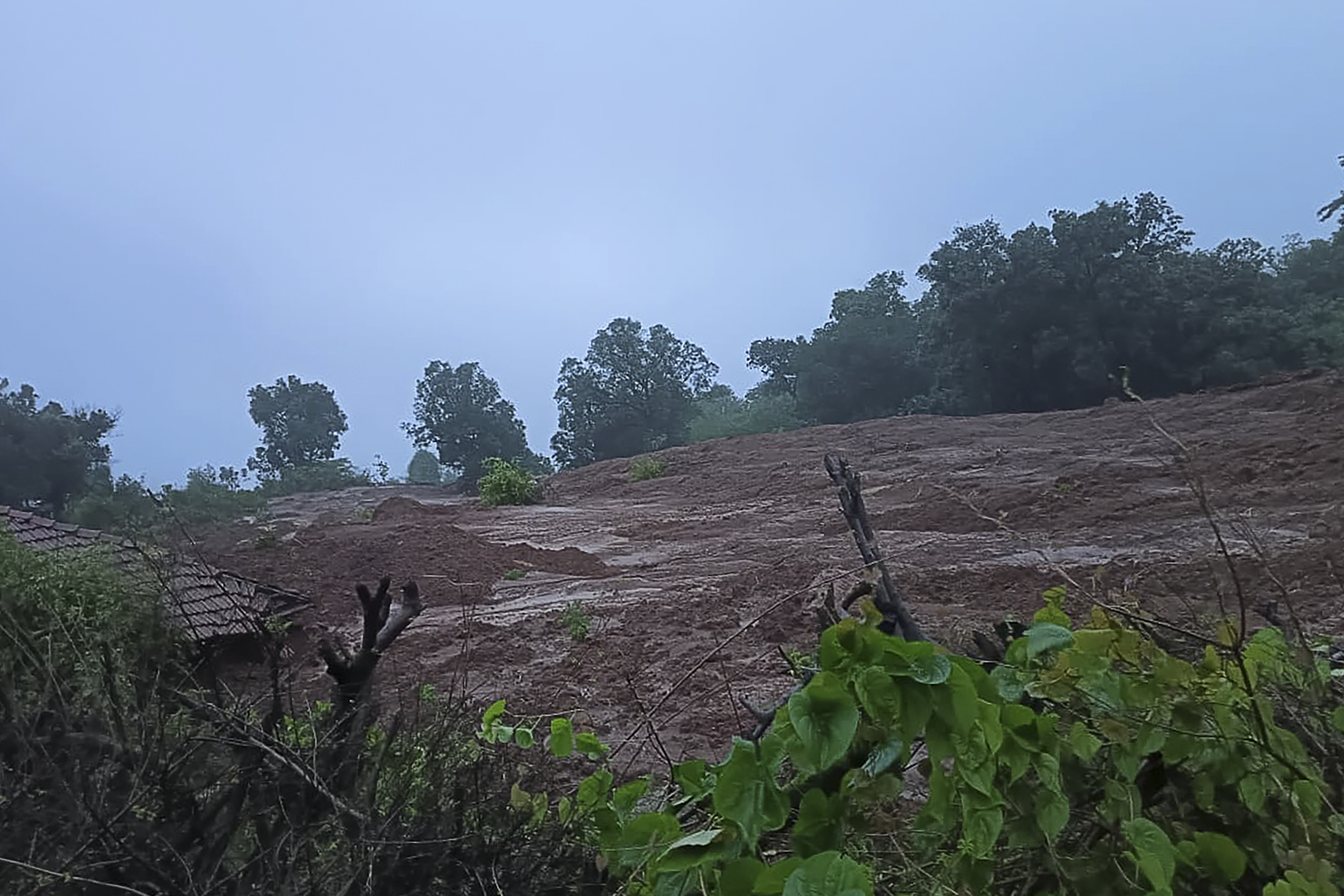 In this handout photograph released by Indias National Disaster Response Force (NDRF) and taken on July 20, 2023, shows the site of a landslide at Irshalwadi village of Raigad district in Maharashtra state. (Photo by - / Indias National Disaster Response Force (NDRF) / AFP) / RESTRICTED TO EDITORIAL USE - MANDATORY CREDIT  AFP PHOTO / INDIAS NATIONAL DISASTER RESPONSE FORCE (NDRF) - NO MARKETING - NO ADVERTISING CAMPAIGNS - DISTRIBUTED AS A SERVICE TO CLIENTS - RESTRICTED TO EDITORIAL USE - MANDATORY CREDIT  AFP PHOTO / Indias National Disaster Response Force (NDRF) - NO MARKETING - NO ADVERTISING CAMPAIGNS - DISTRIBUTED AS A SERVICE TO CLIENTS /