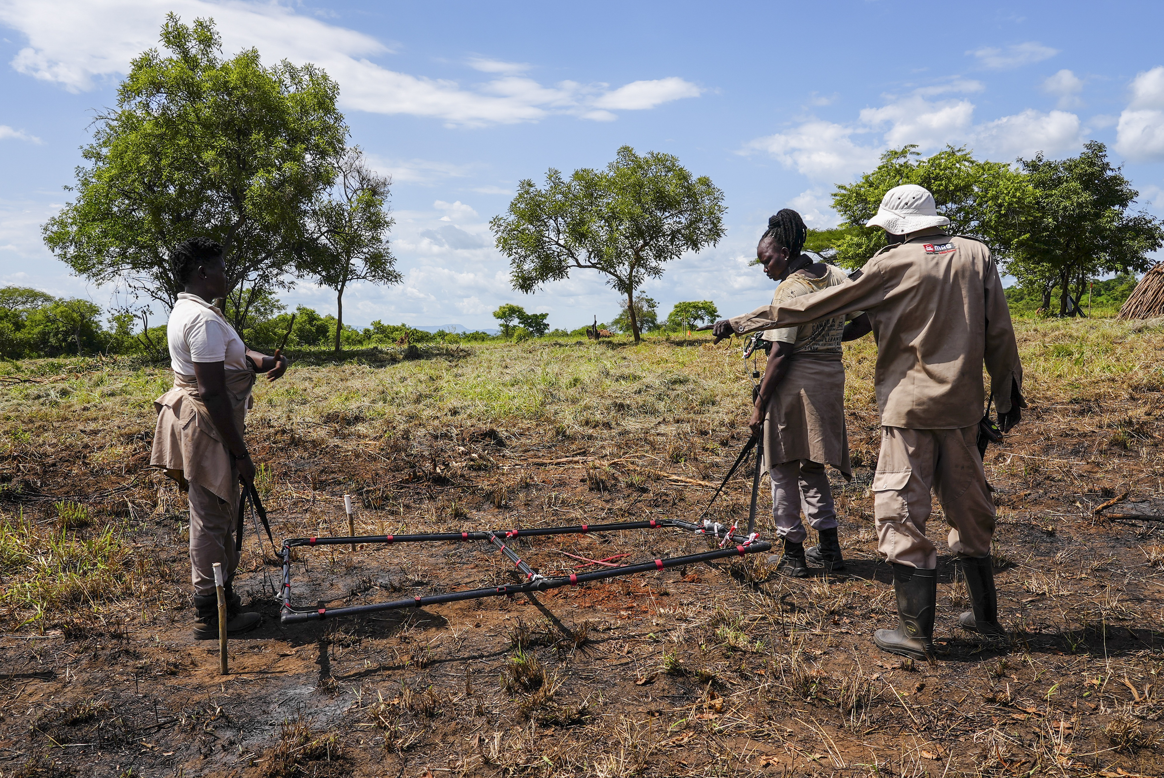 A team of deminers do clearance at a site containing cluster munitions in Ayii, Eastern Equatoria state, in South Sudan Thursday, May 11, 2023