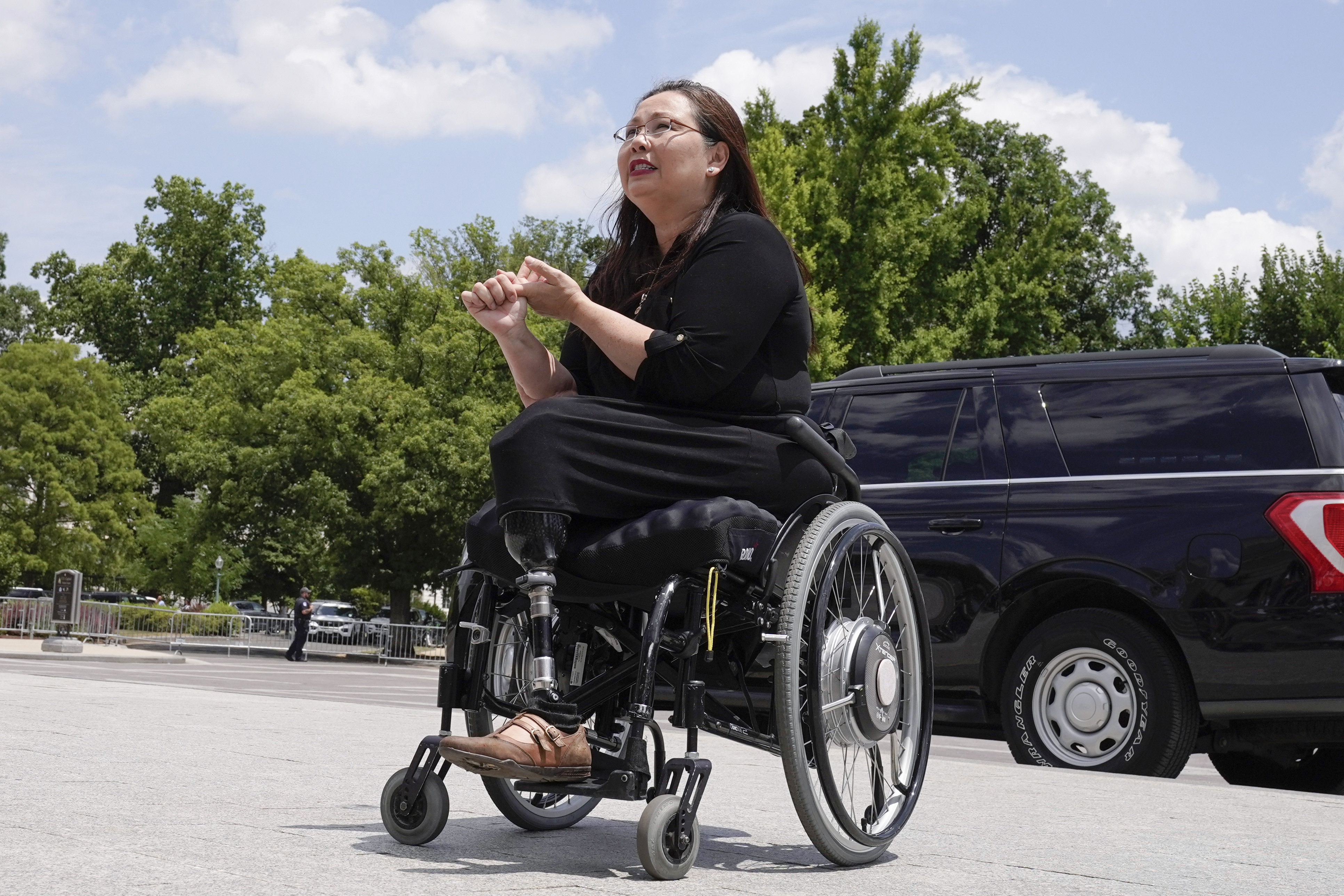 Senator Tammy Duckworth speaks with visitors Tuesday, June 13, 2023, on Capitol Hill in Washington