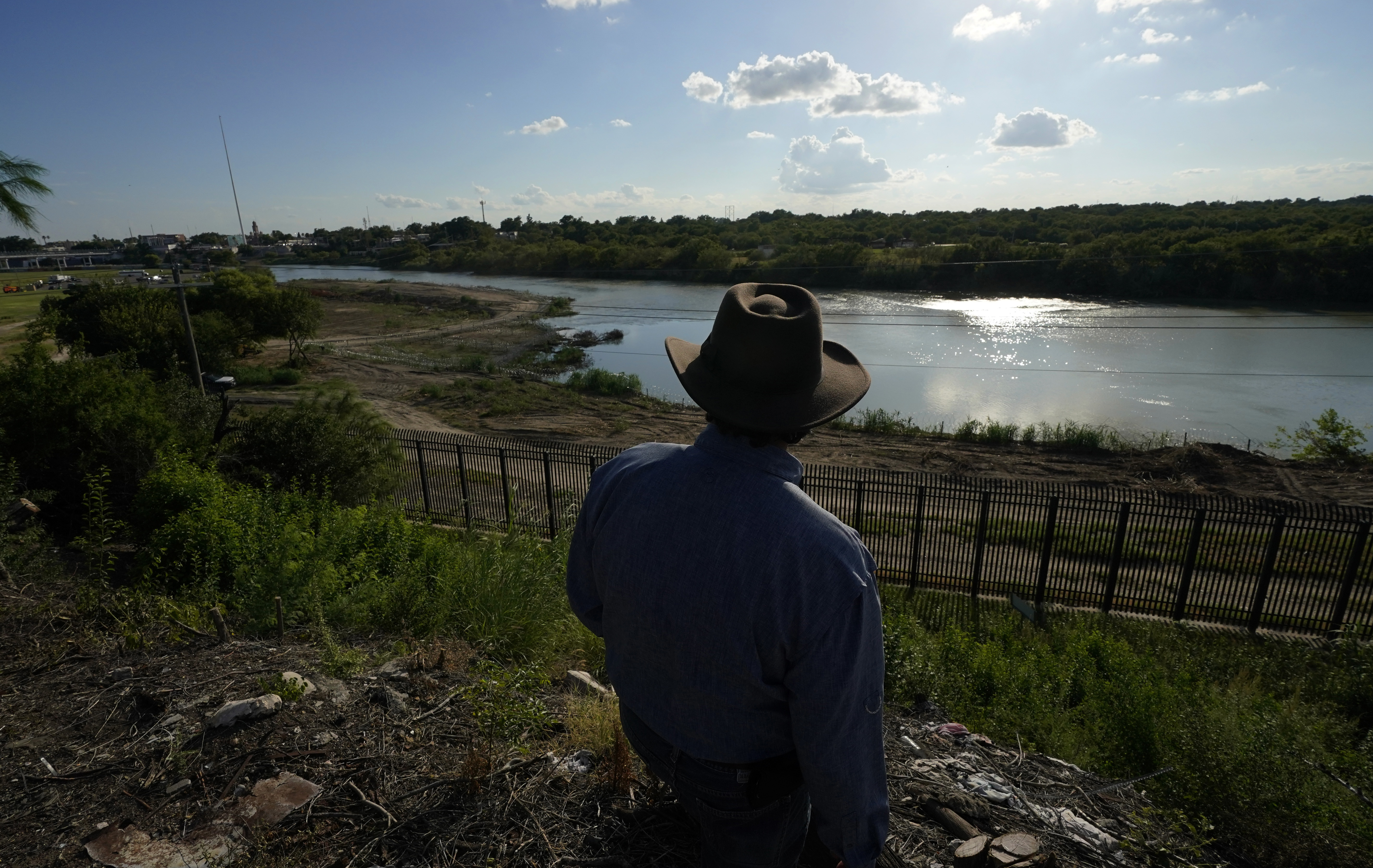 Kayak outfitter Jessie Fuentes stands above the Rio Grande