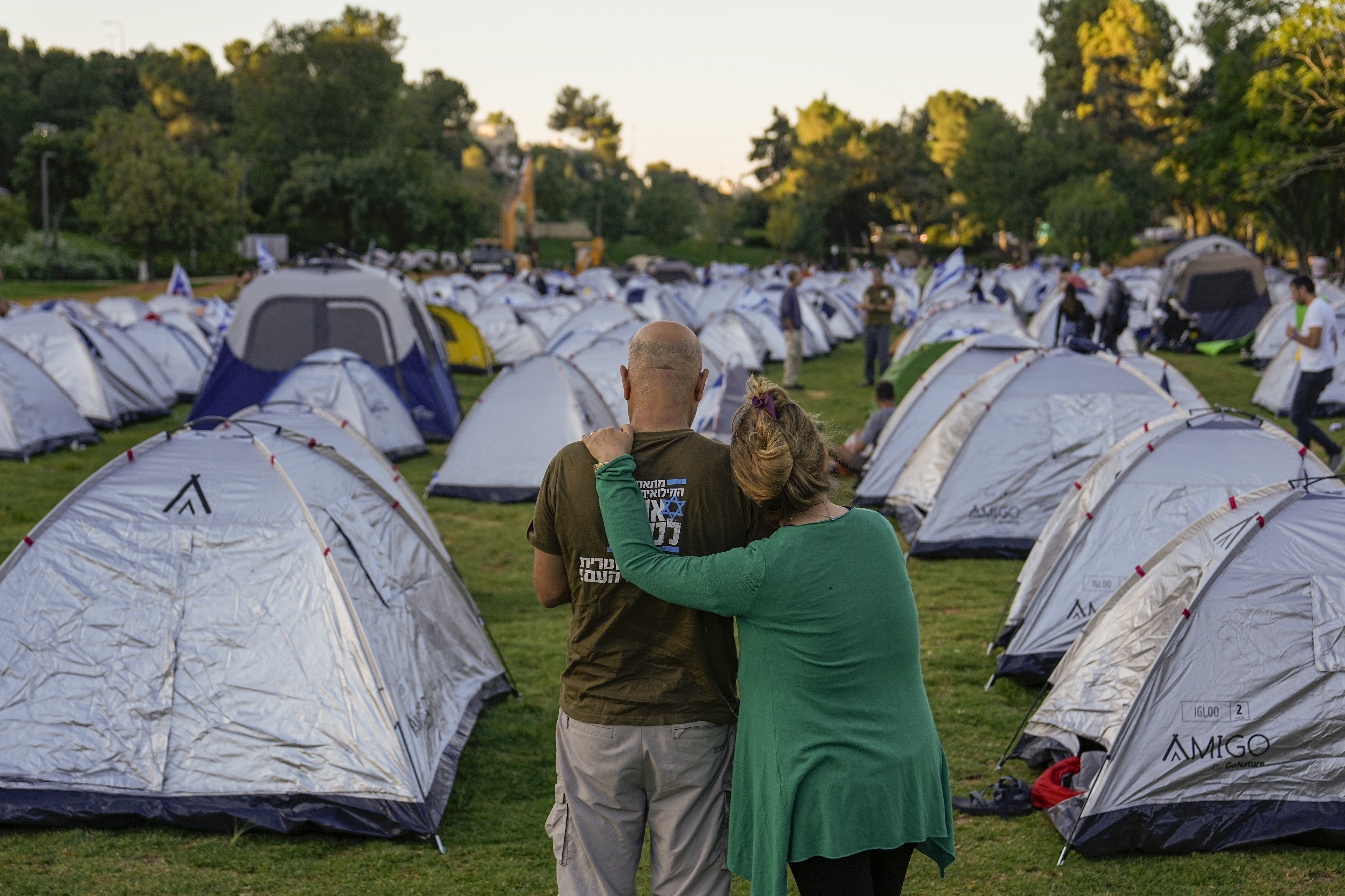 Marchers who completed the last leg of a four-day, 70 kilometer (45-mile) trek from Tel Aviv camp outside Israel's parliament
