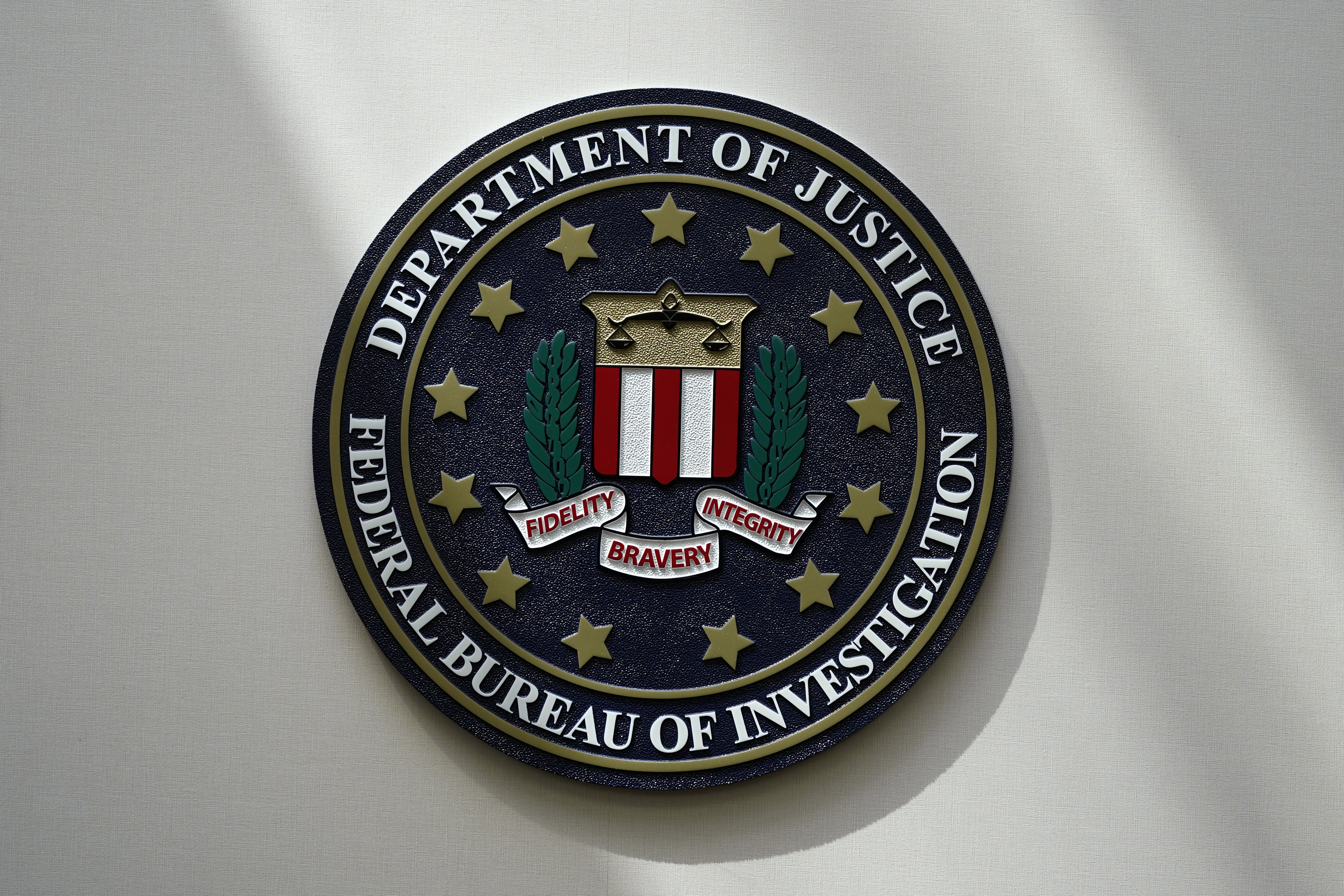 The FBI seal is pictured in Omaha, Neb., Aug. 10, 2022. It features the words "Department of Justice" and "Federal Bureau of Investigation", with a pattern of stars in a circle and a banner in the centre.