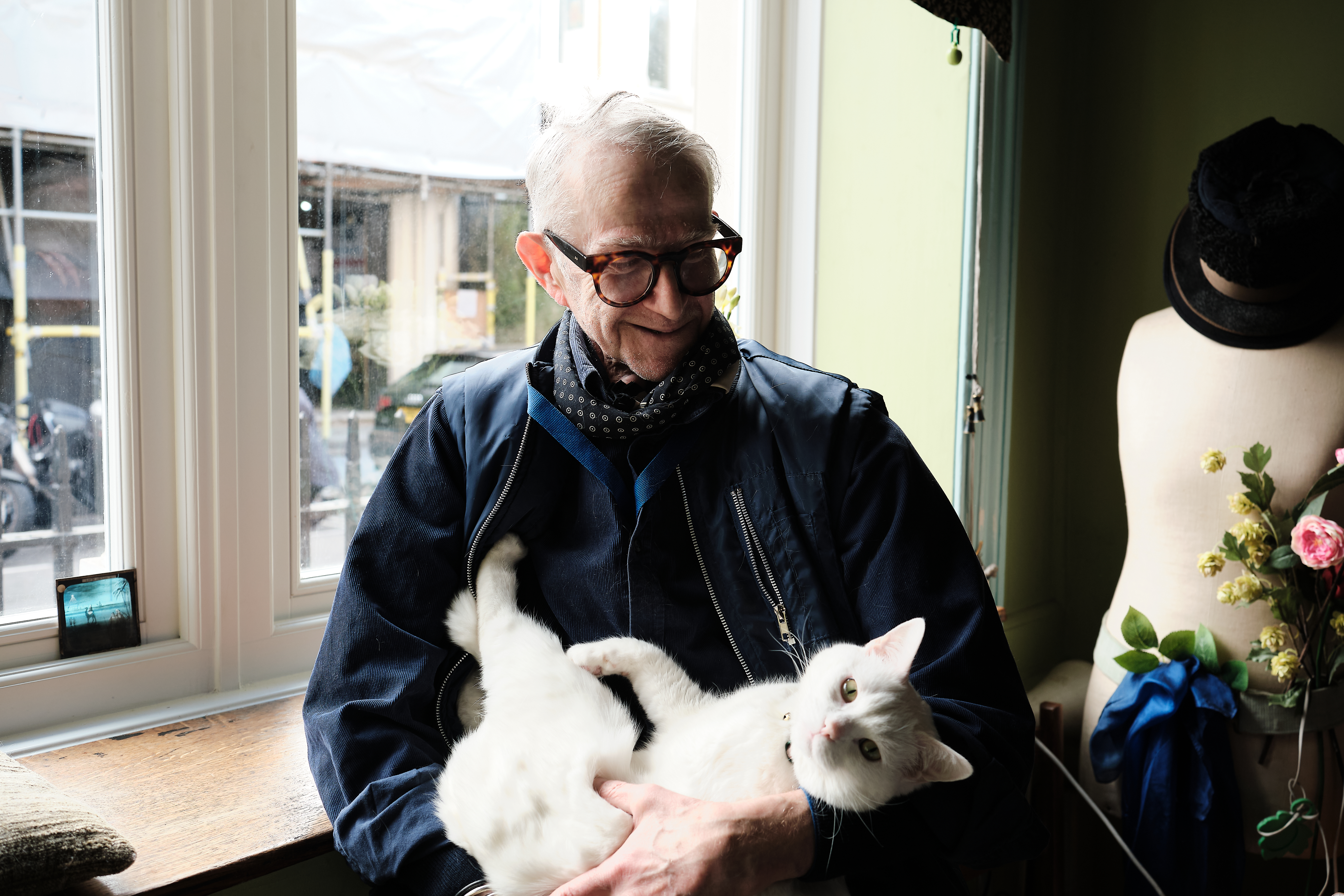 Spyridon Koskinas, in his front room in central London, March 2023