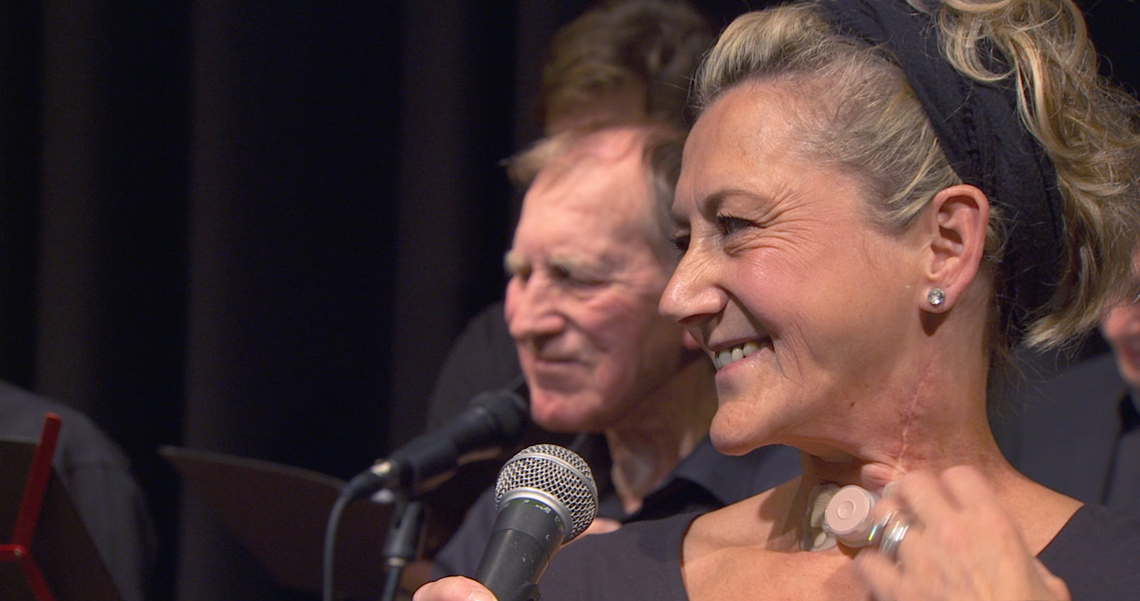 Picture of Sara, close-up on stage: still from "Can You Hear My Voice?" By Bill Brummel 2020