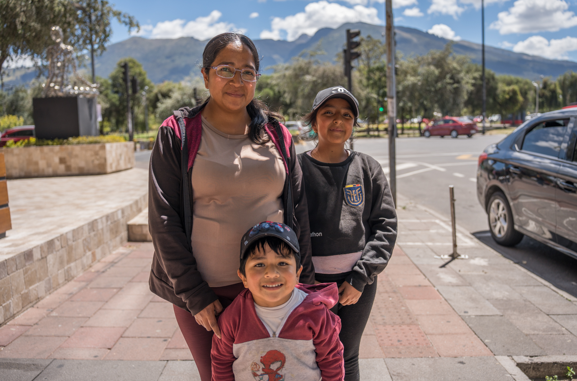 Diana Coyentes, 29, cleaning woman from the province of Cotopaxi is pictured with two children