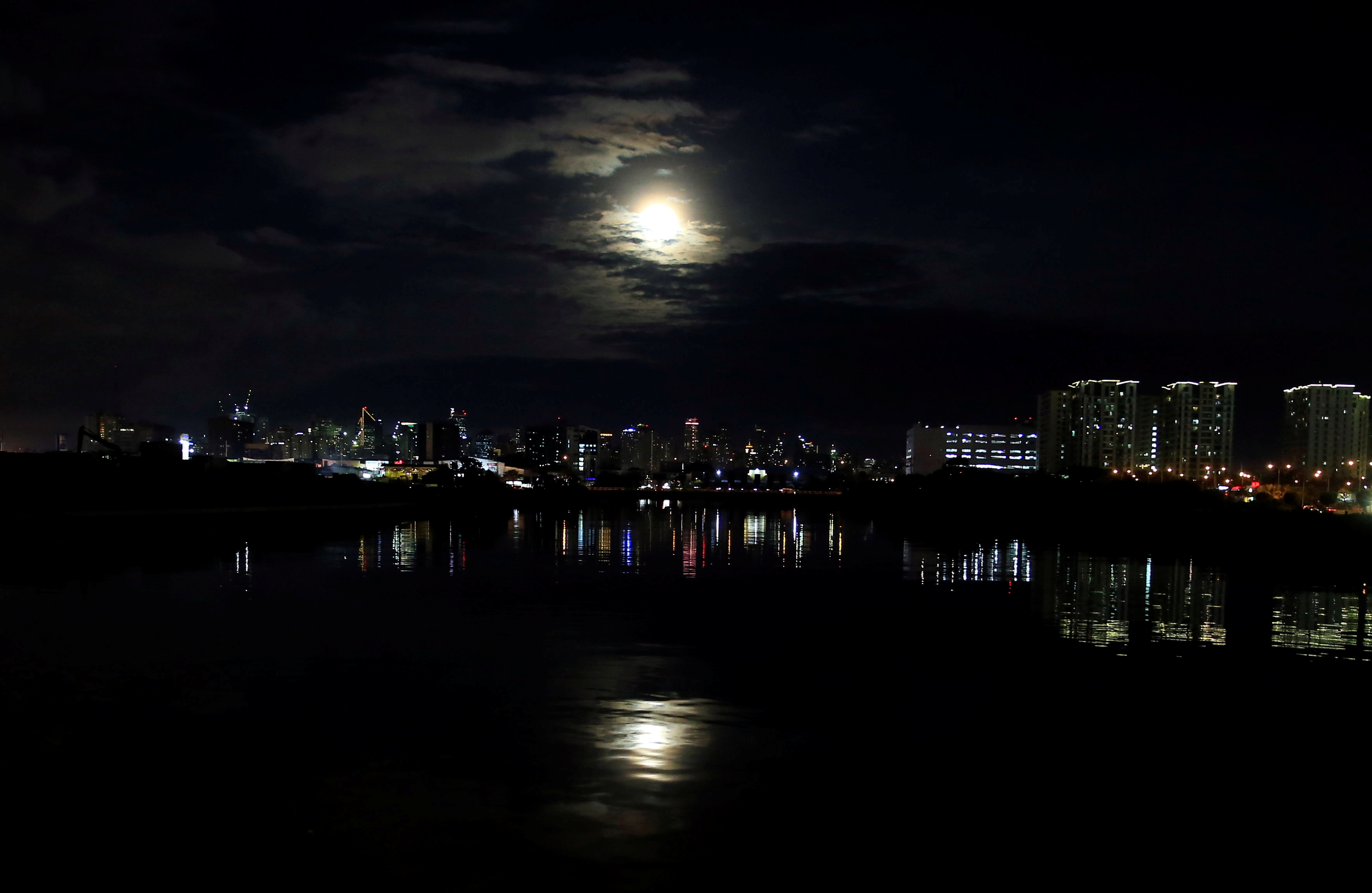 The super blue moon rises over Central Business District in Makati city, Metro Manila, Philippines